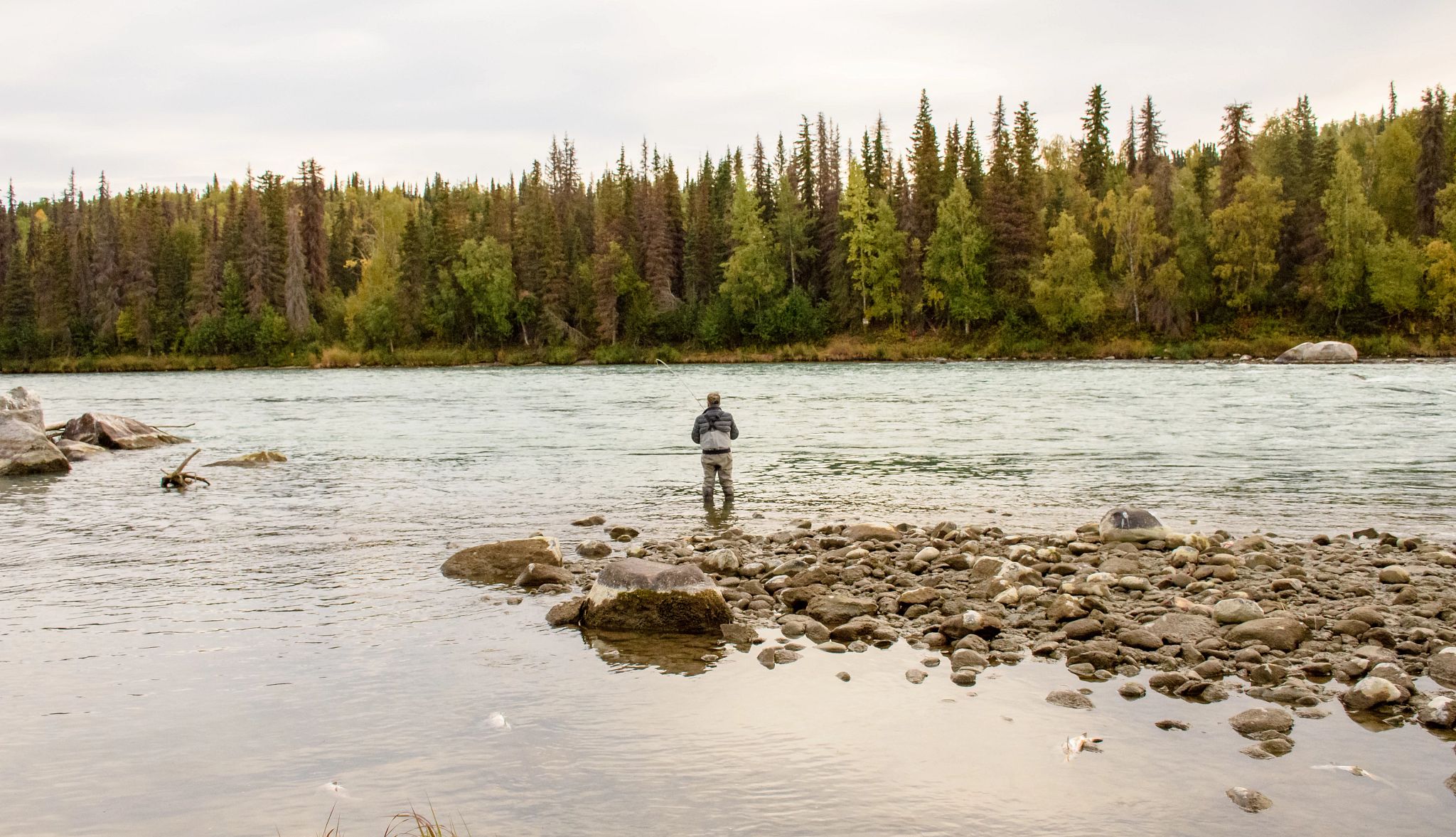 Retirementmoon a man standing in water and fishing