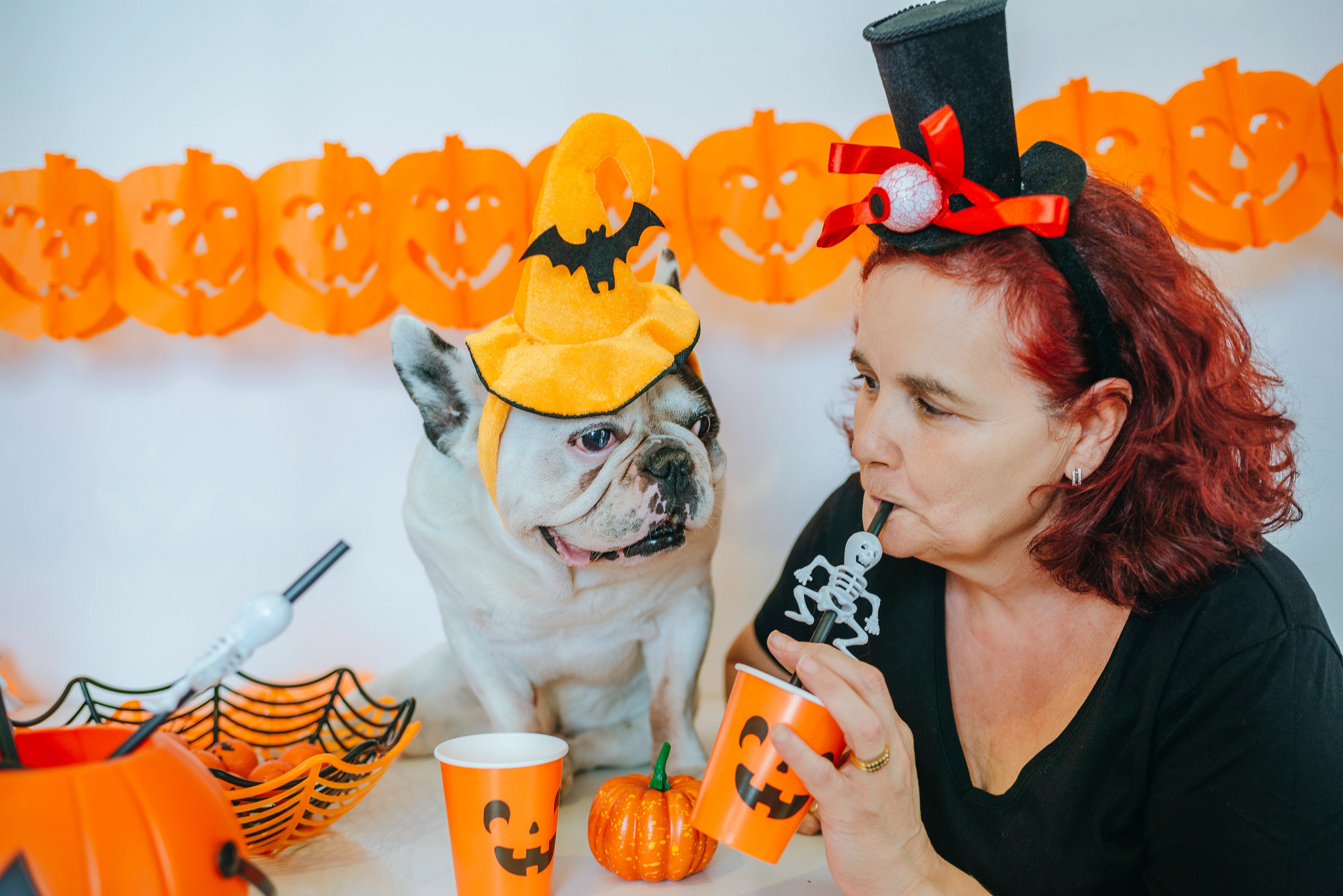 Mature woman celebrating halloween with her dog