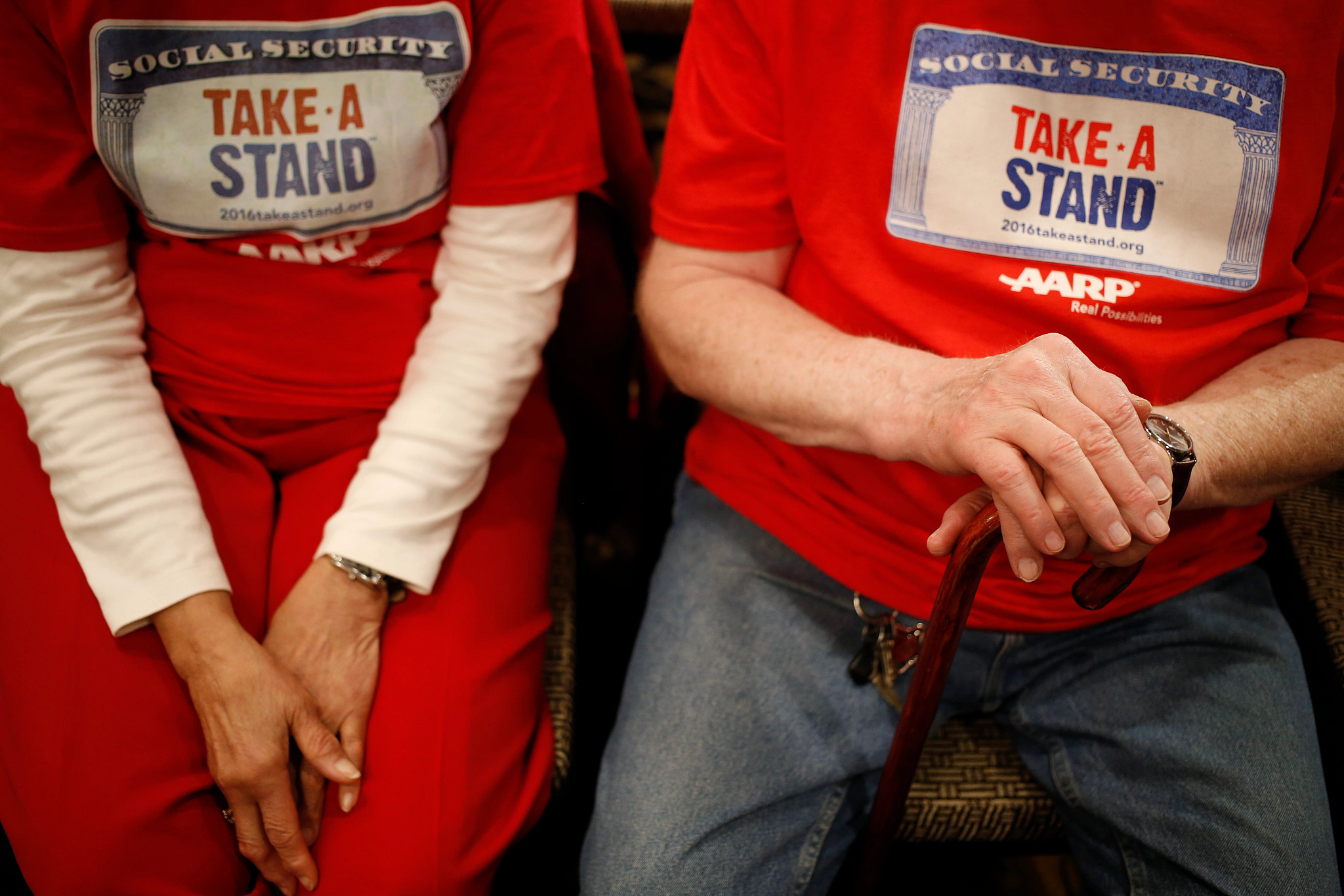 people wearing red shirts with take a stand written on them