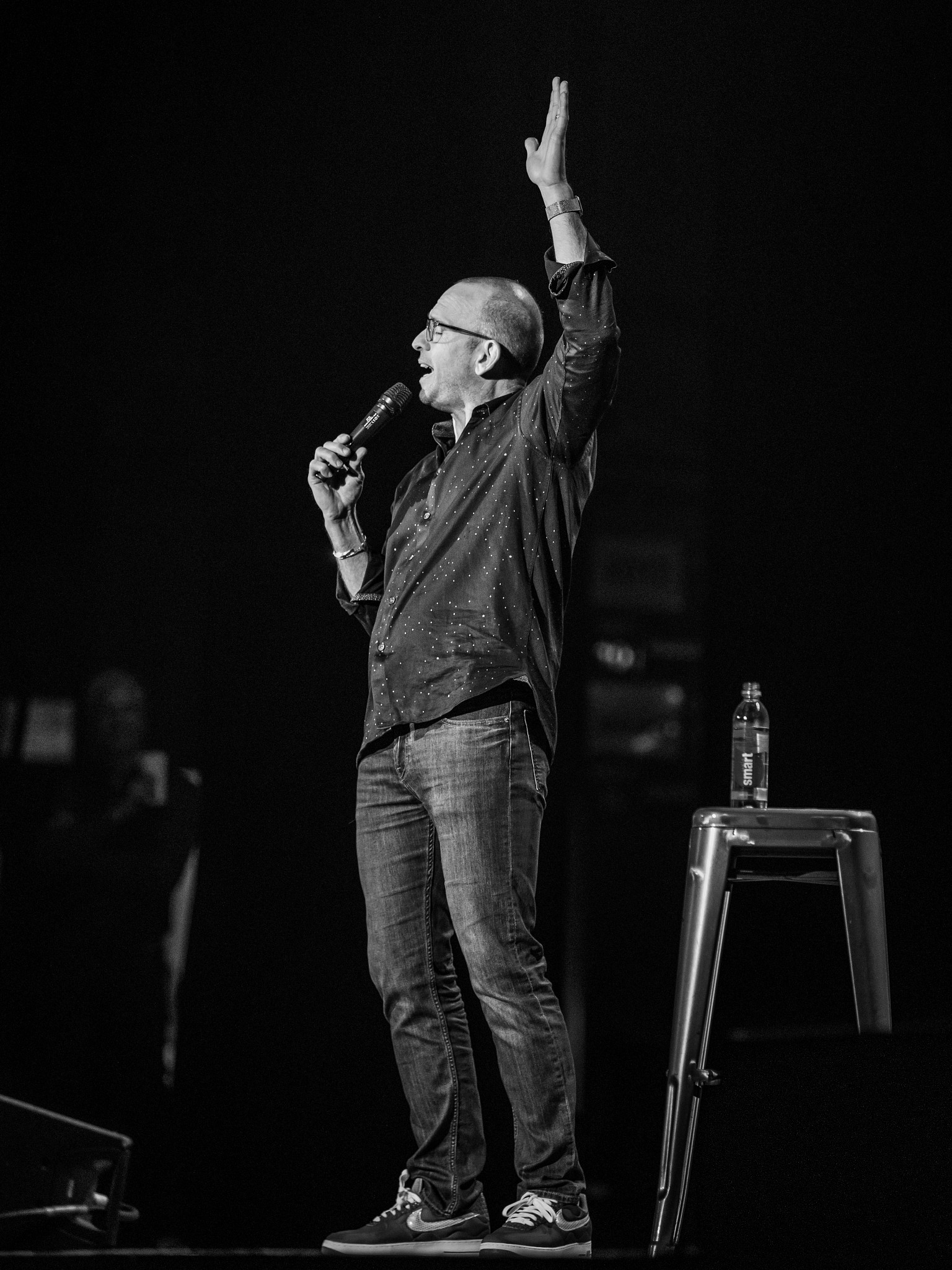 paul ollinger on stage at a stand up comedy show