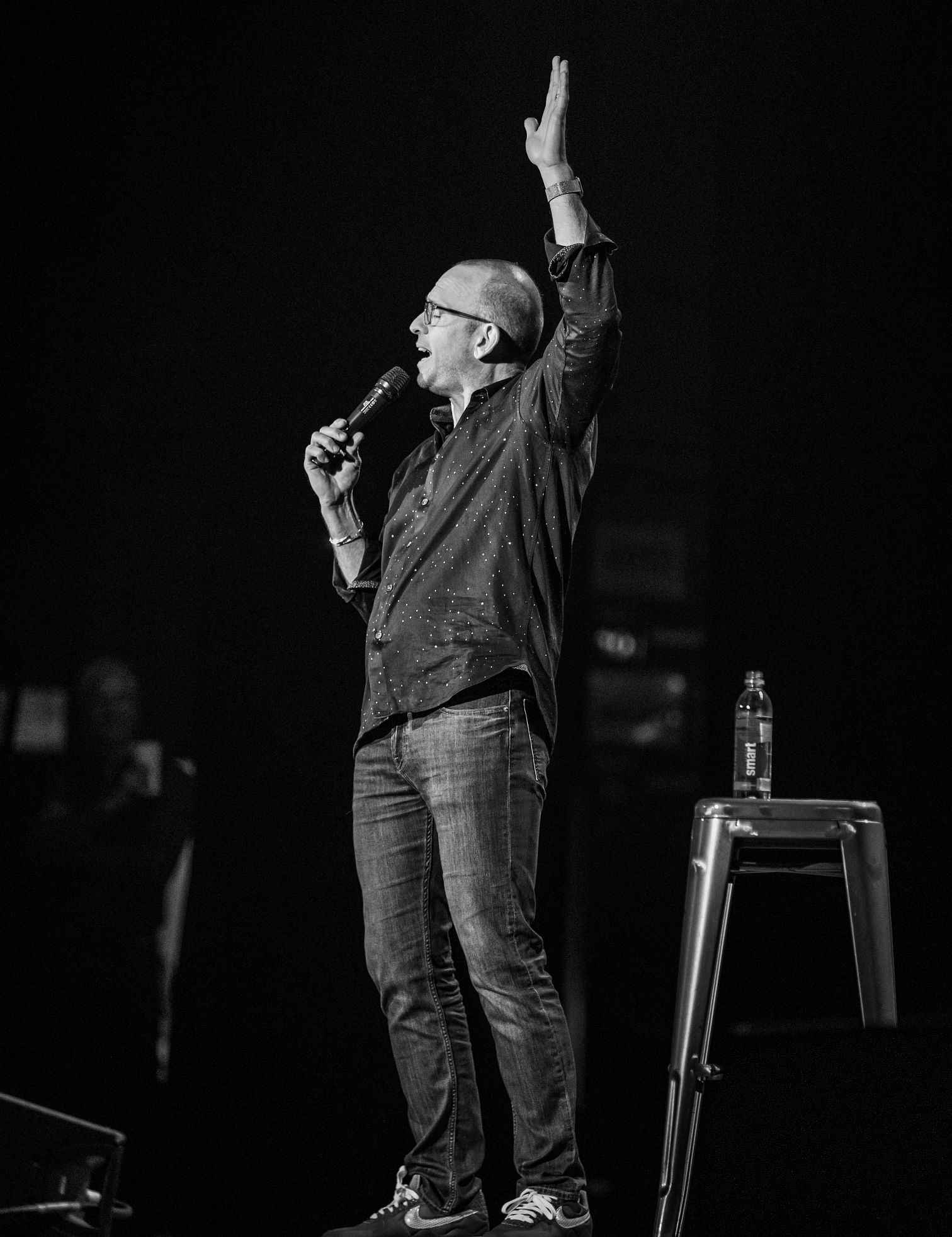 Paul Ollinger paul ollinger on stage at a stand up comedy show