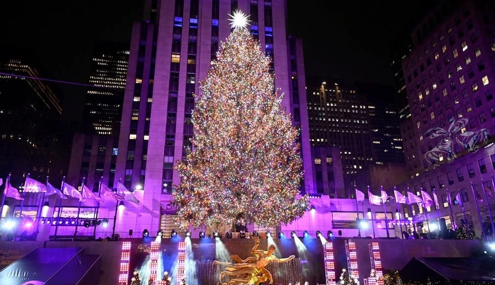 Christmas Movies and Specials a christmas tree with lights and decorations on it