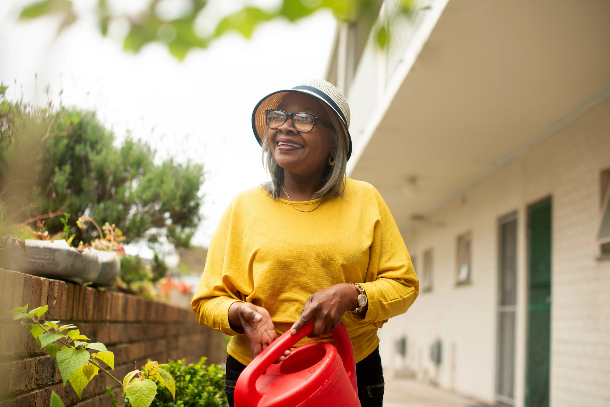Woman outside her home.
