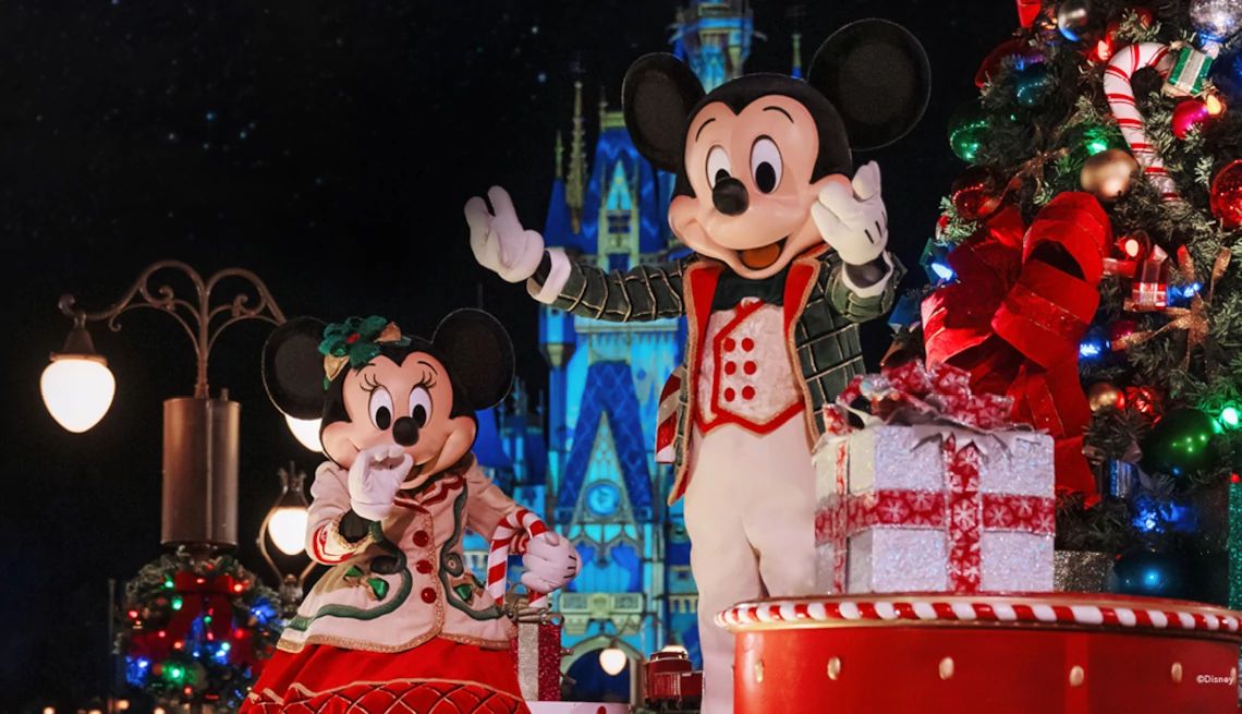 Walt Disney World Resort Mickey and Minnie Mouse at a holiday celebration at Walt Disney World Resort
