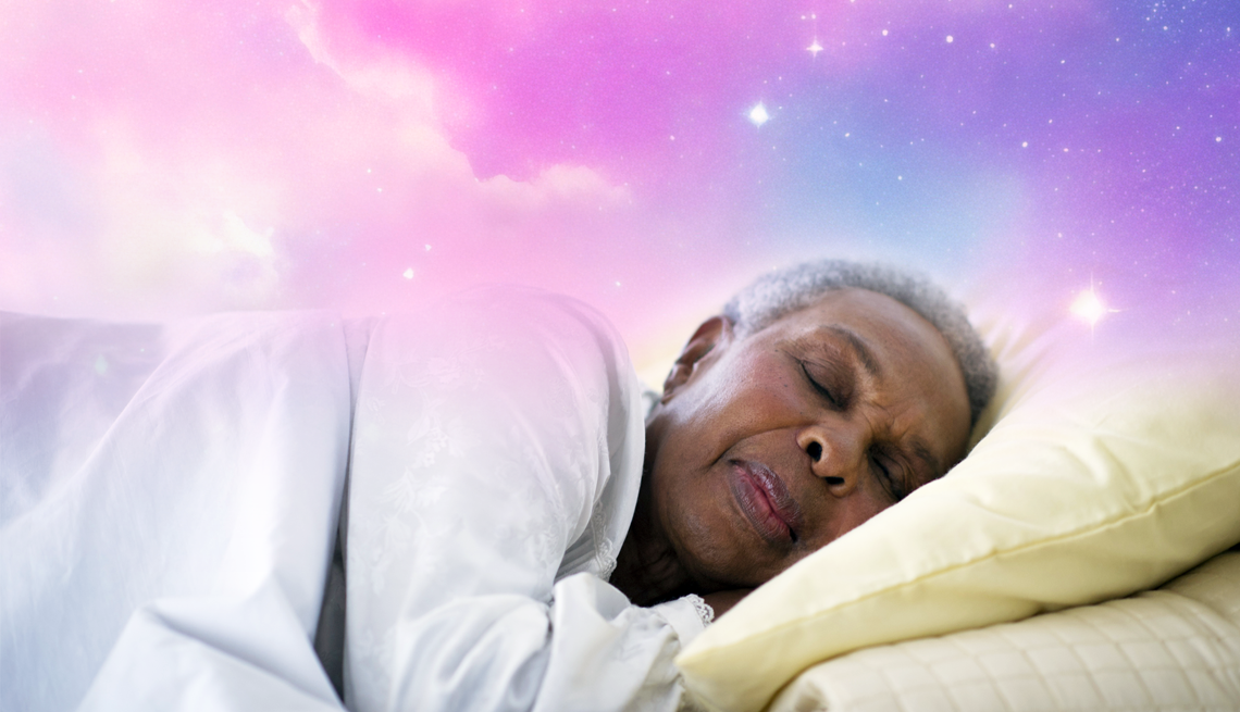 What Happens in the Brain During Dreams a woman sleeping on her side against a pink galaxy background