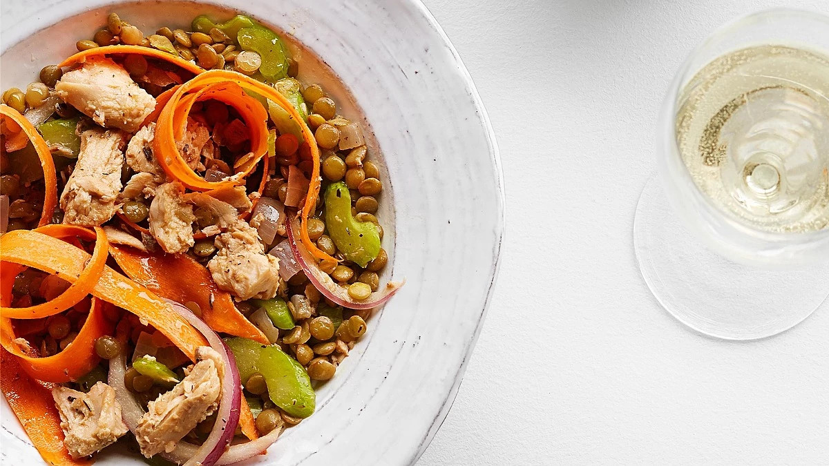 A close-up view of quick lentil salmon salad on a plate