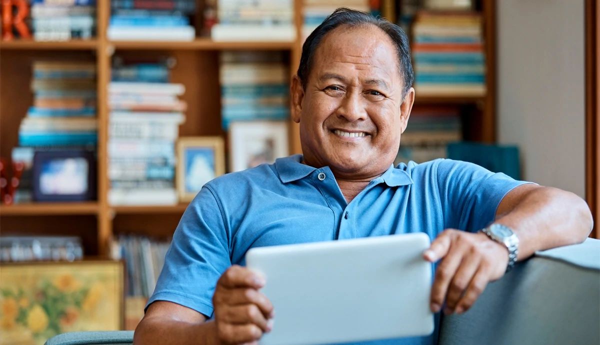 Man on couch smiling