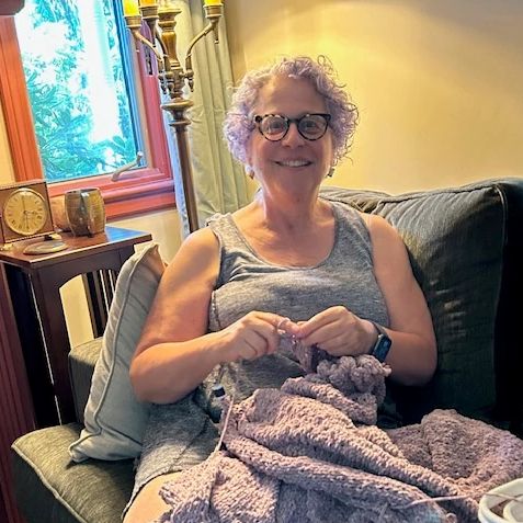 Return to Your Childhood Hobbies  a photo shows Tina B. Kane knitting