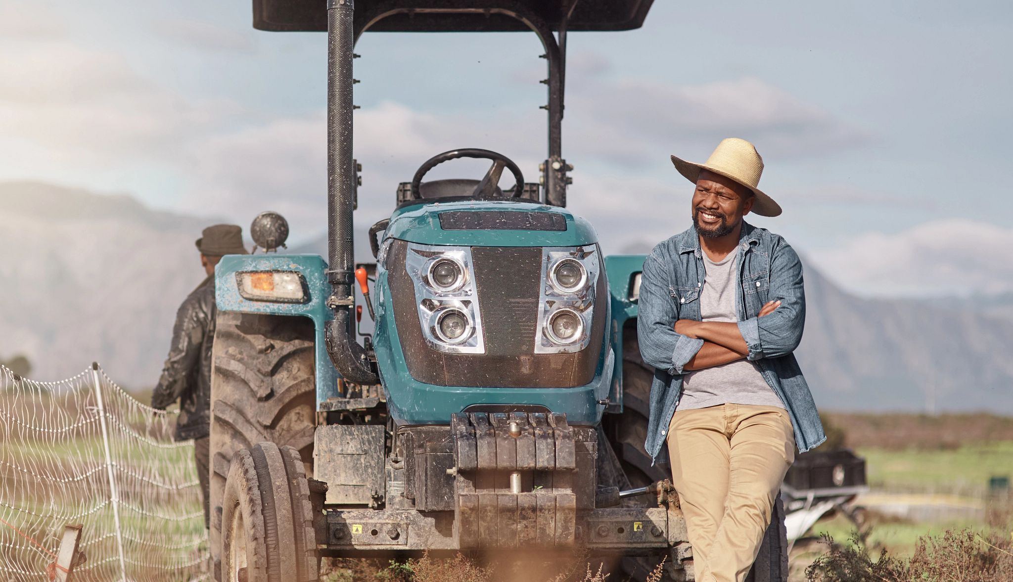 Man leaning on a tractor Man leaning on a tractor