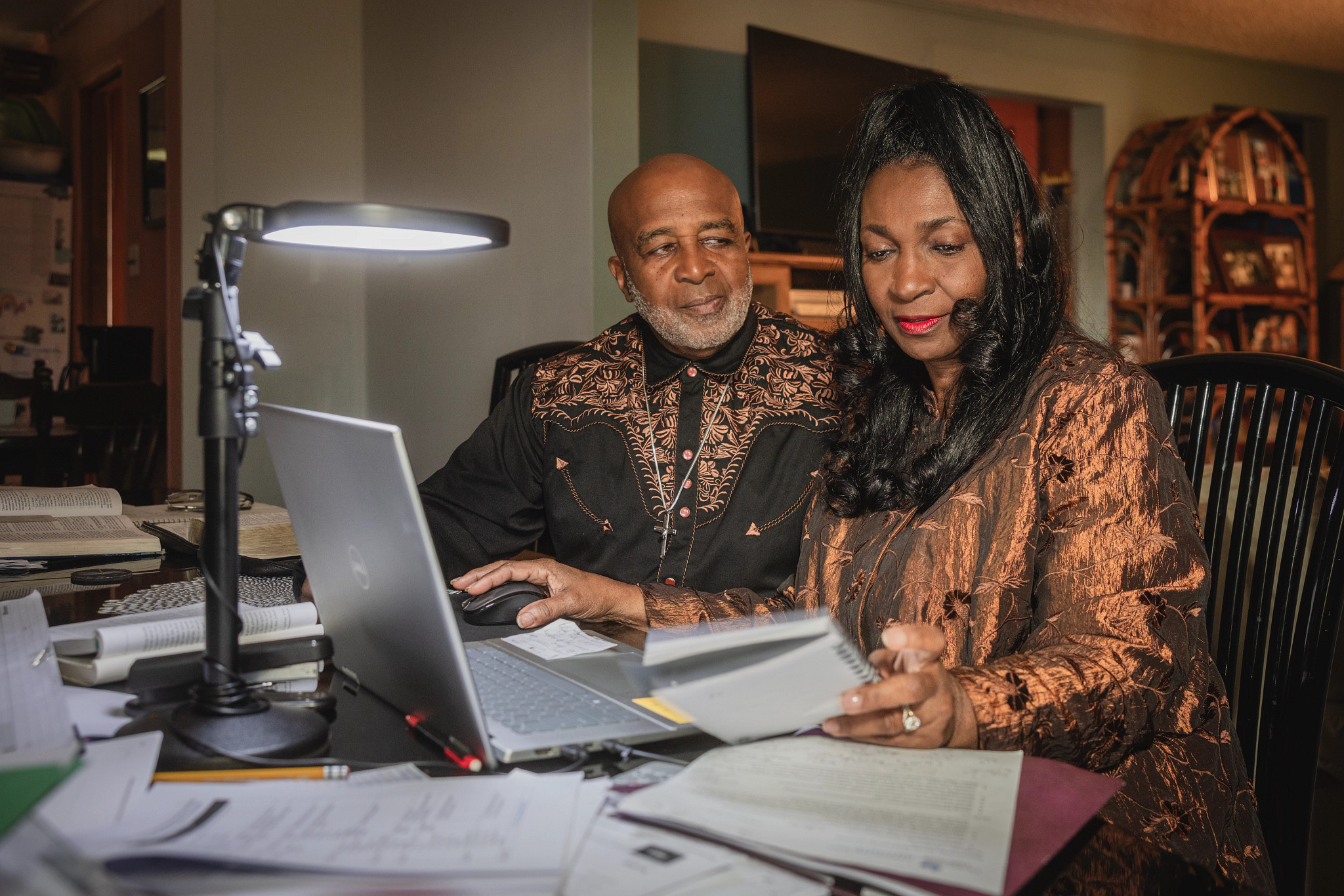 two people sitting together at a table