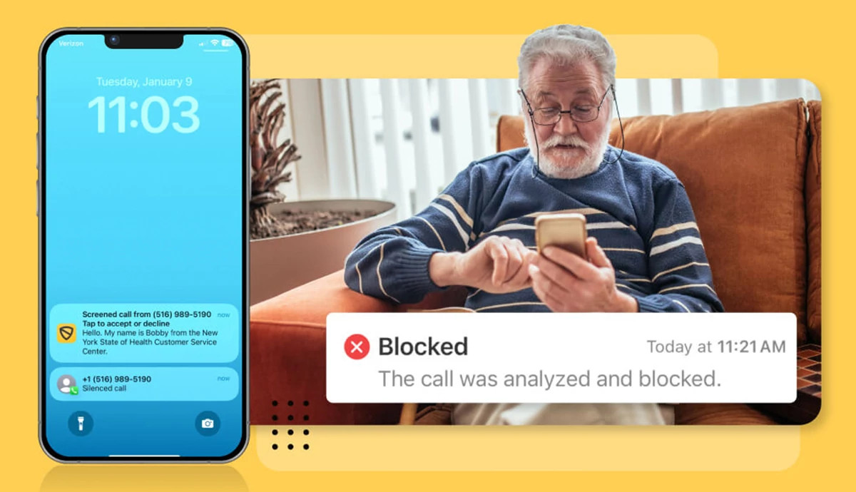 a phone a and a man sitting on a chair