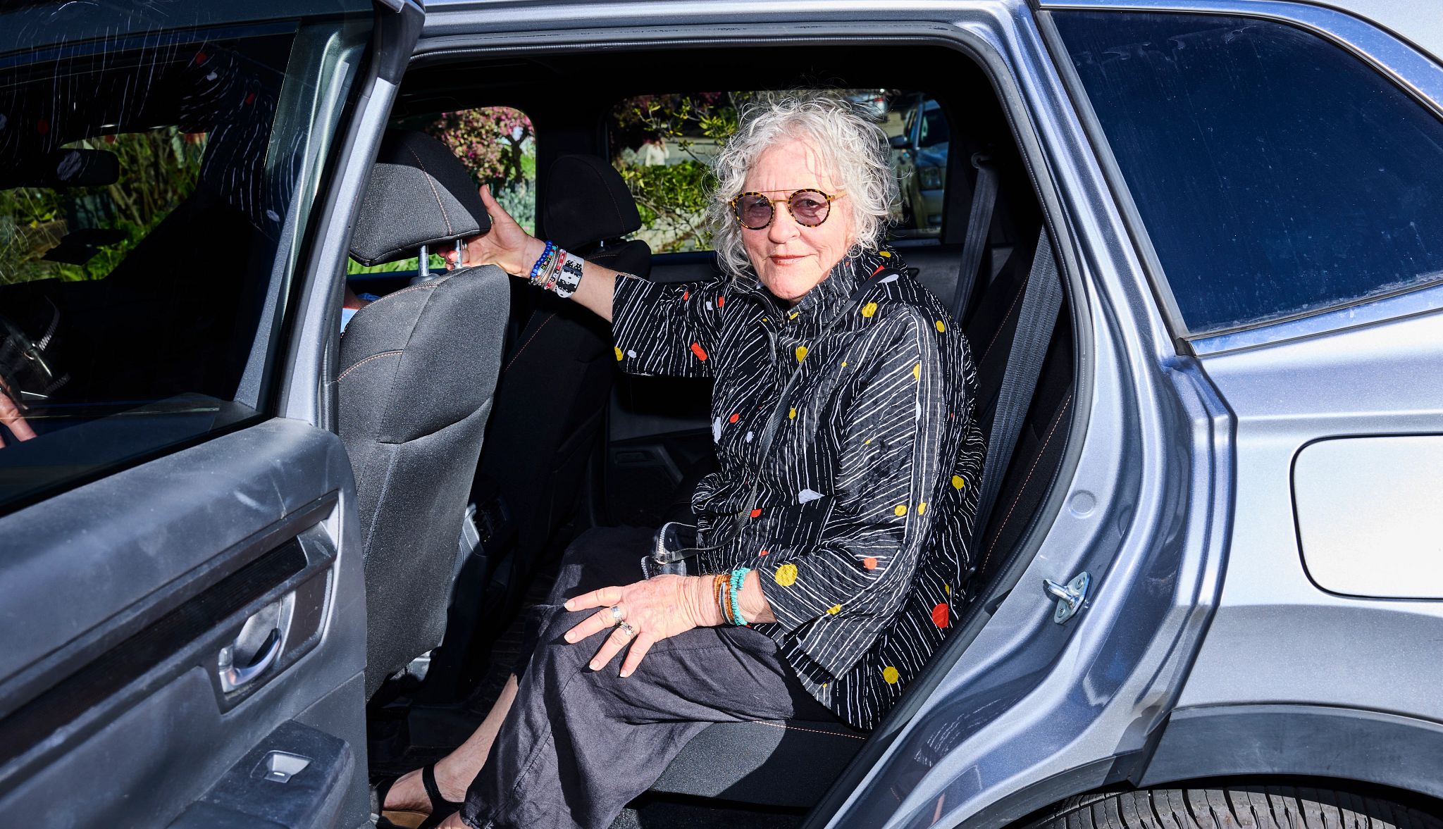 Ride-Share Apps Make Life Easier jane gregorius sits in the back of a ride share s u v