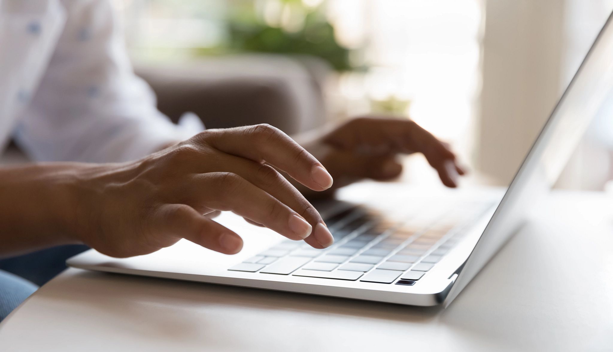 Typing on Laptop person typing on laptop