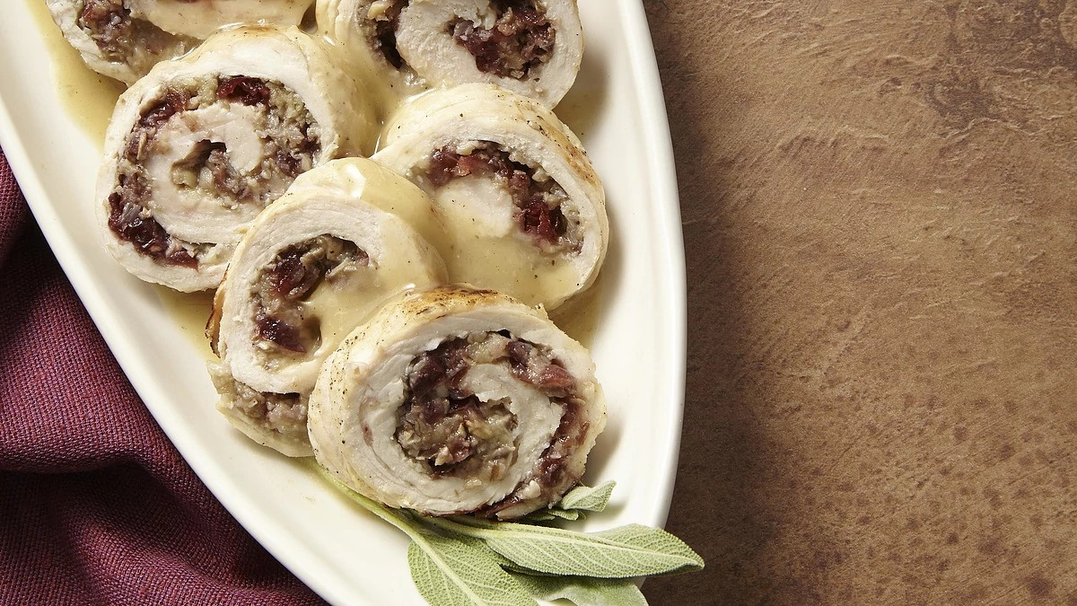 A close-up view of cranberry-stuffed turkey cutlets on a plate