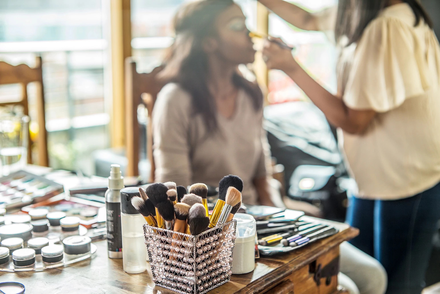 woman getting her makeup professionally done