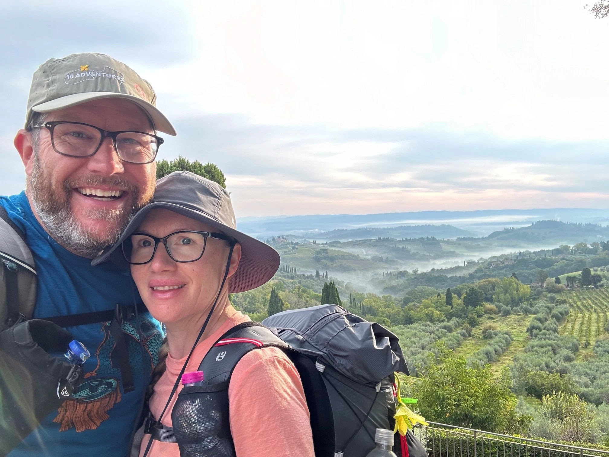 Richard and Lynn Campbell pose for a photo while hiking the Via Francigena Trail in Italy