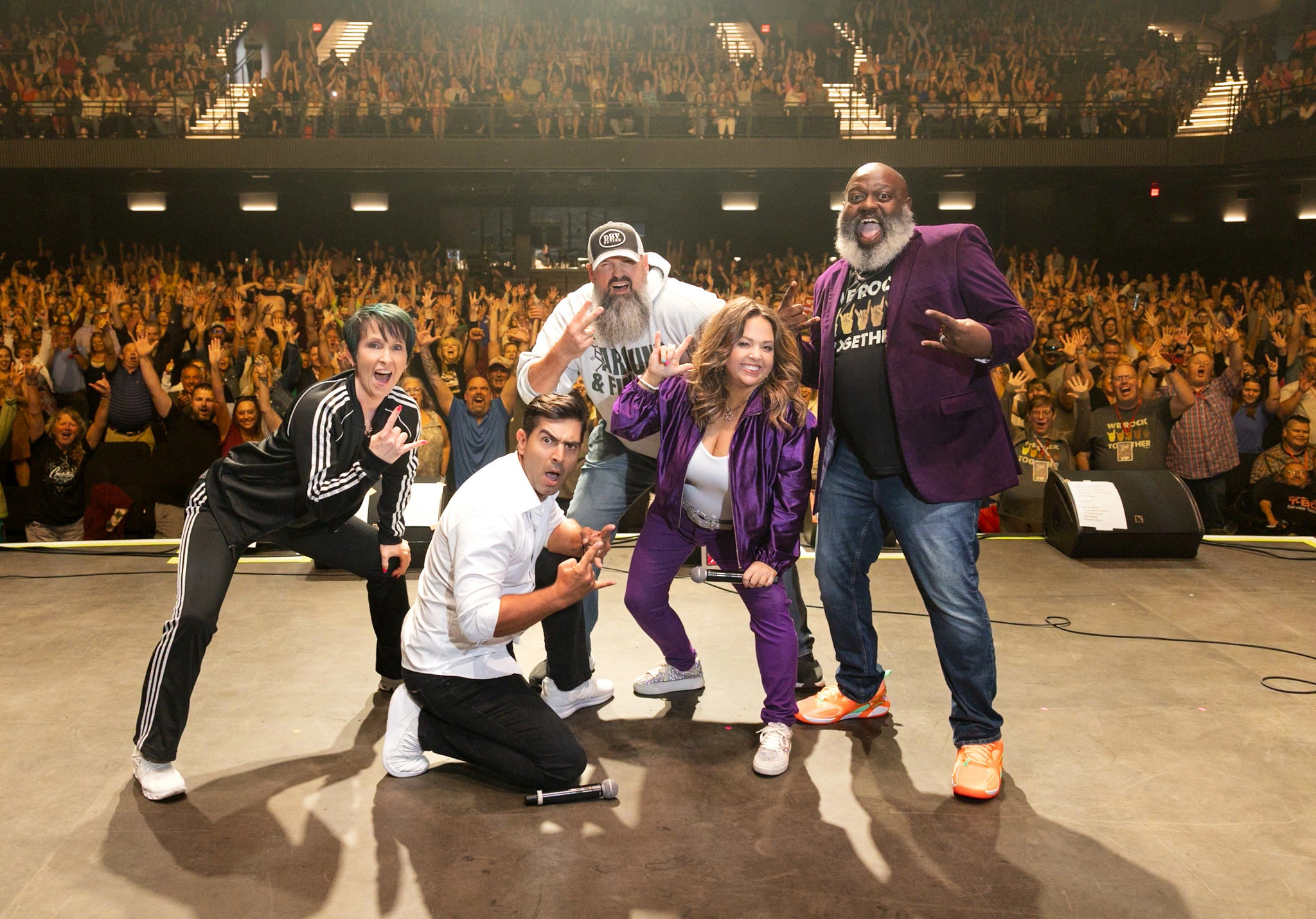 A photo shows comedian Sherri Dindal, host Justin Rupple and comedians Jon Wellington, Kelly Manno and Nick Harrison at a tour stop in Seattle, Washington.