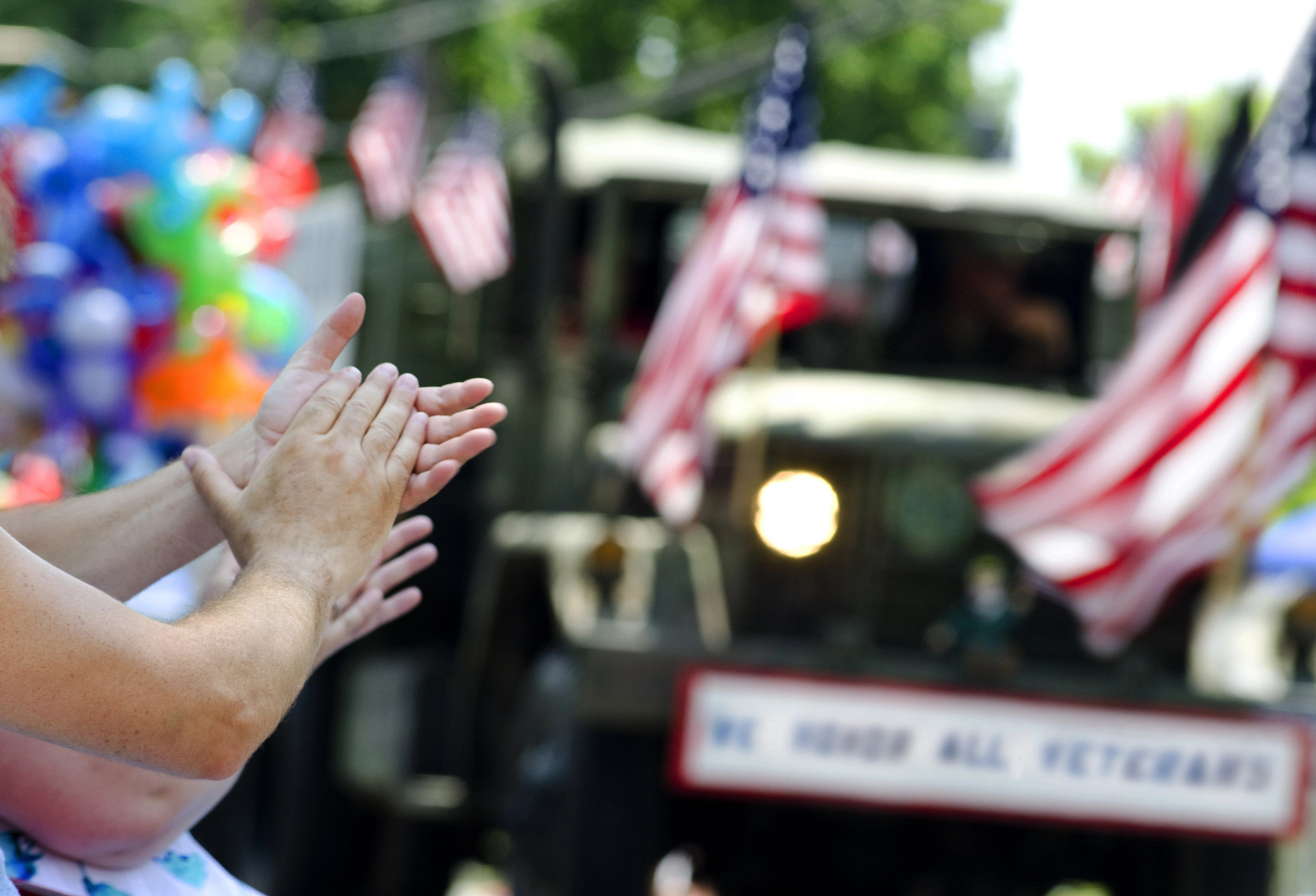 people clapping at a parade