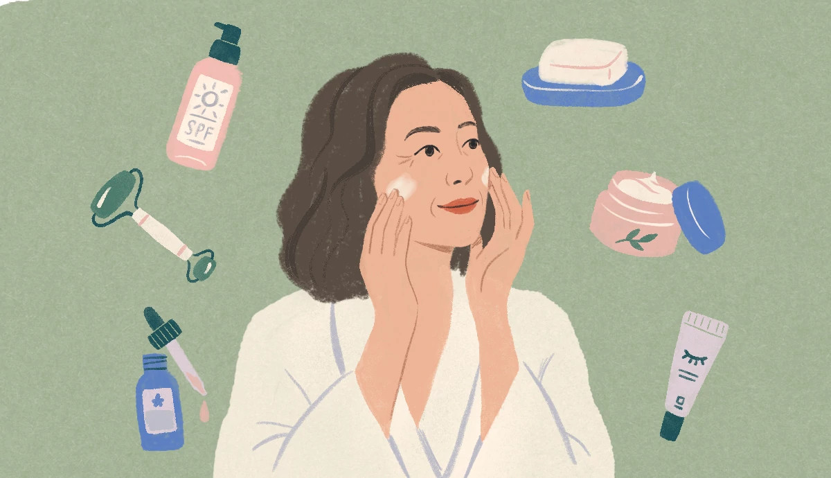 Skin care products and tools surround a woman as she puts cream on her face.