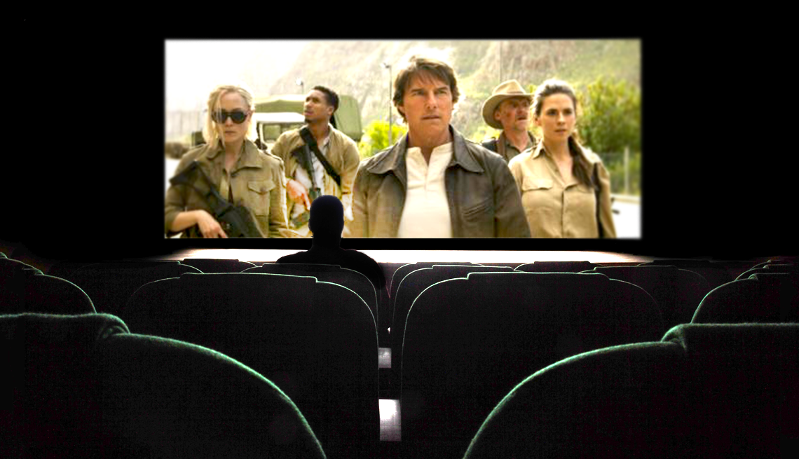 Mission: Indispensable A photo shows a man in silhouette at a movie theatre watching ‘Mission Impossible: The Final Reckoning.’