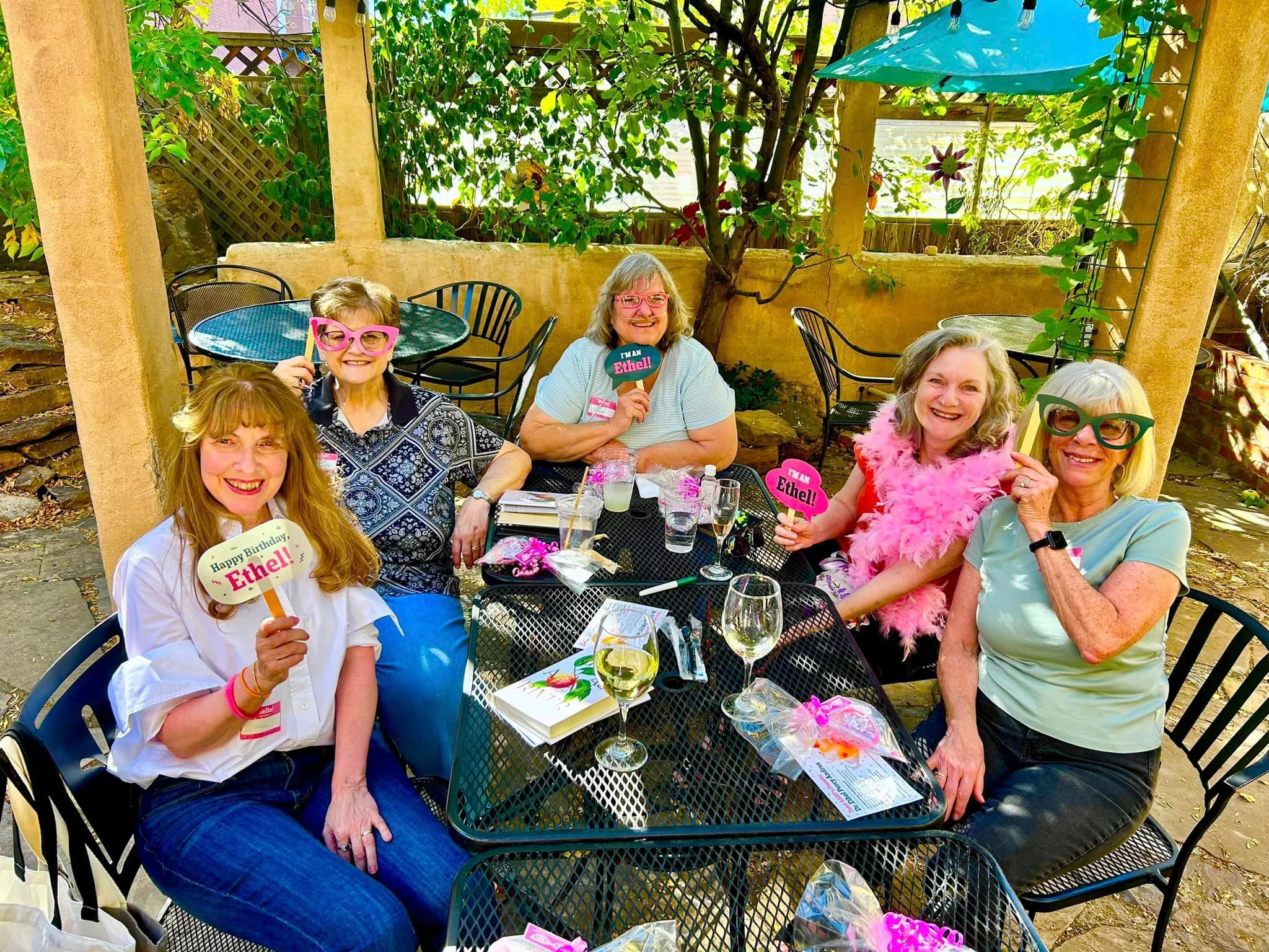 A group of women eating at a restaurant wearing Ethel horn rimmed glasses for The Ethel Gathering Groups