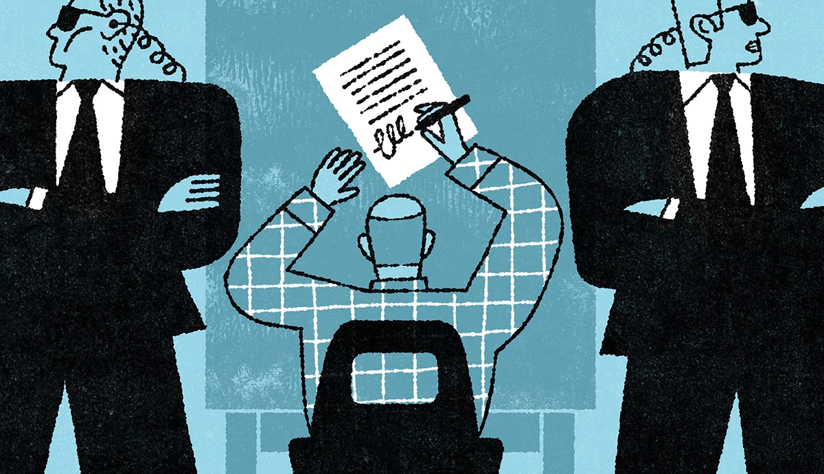 Two security guards stand by while someone signs paperwork