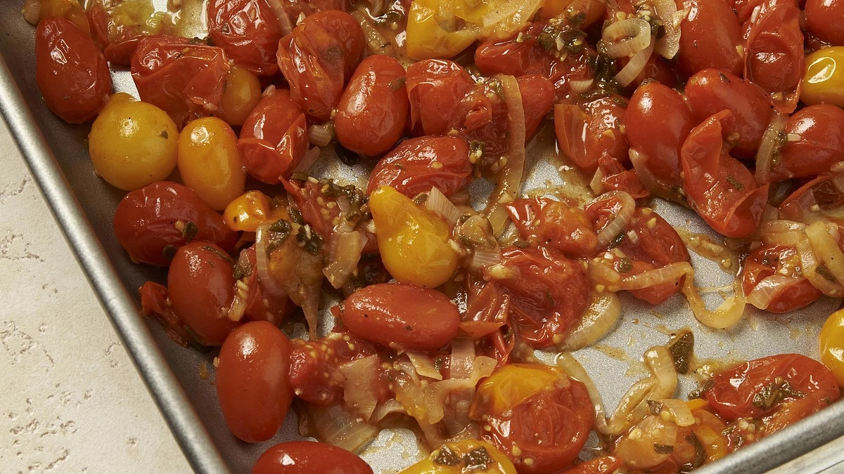 A close-up view of roasted cherry tomato and sage sauce
