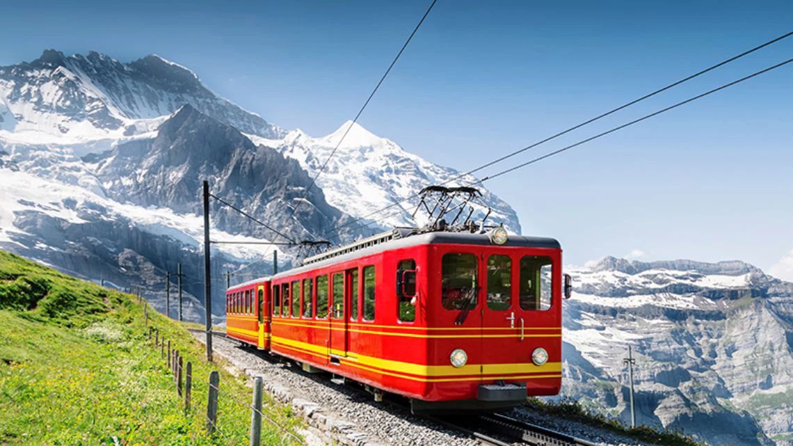 Train riding by the mountains