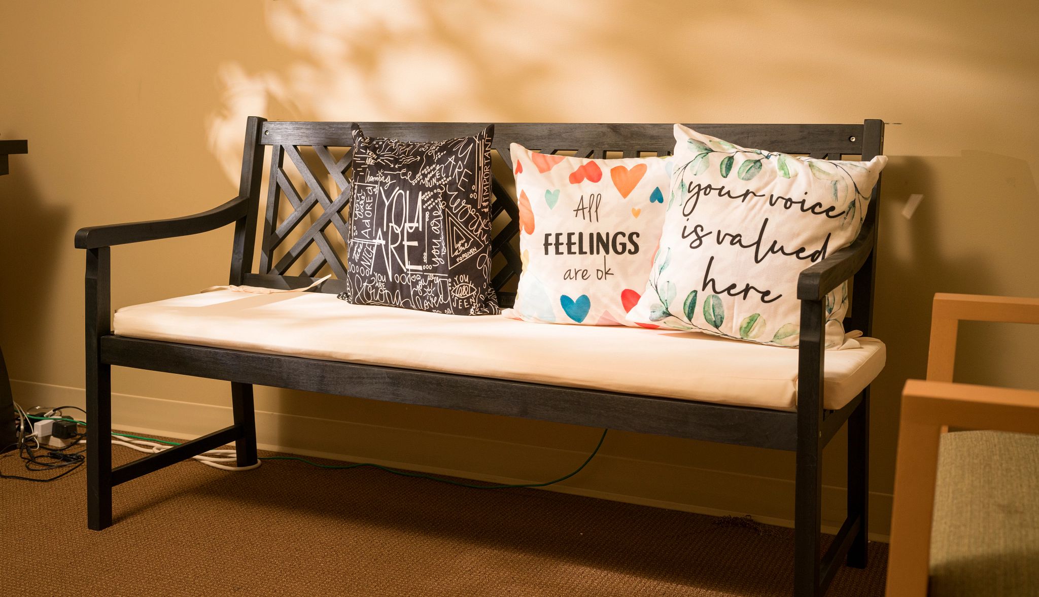Friendship Bench Program Offers Mental Health Support A photo shows the indoor Friendship Bench at the senior center in Washington, D.C., where Angela Jasper and Robin Baxter often meet.