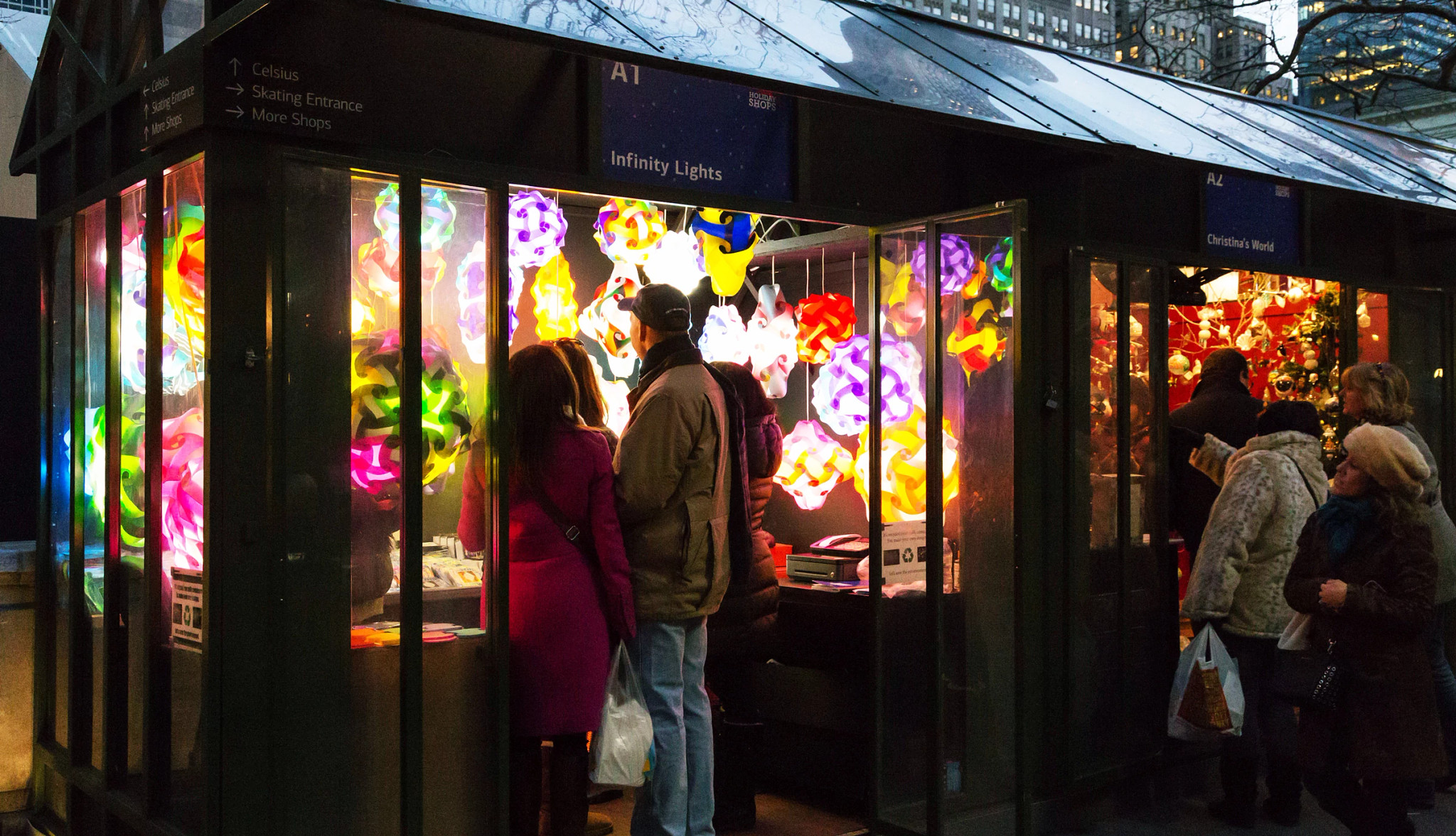 people shopping at a holiday market