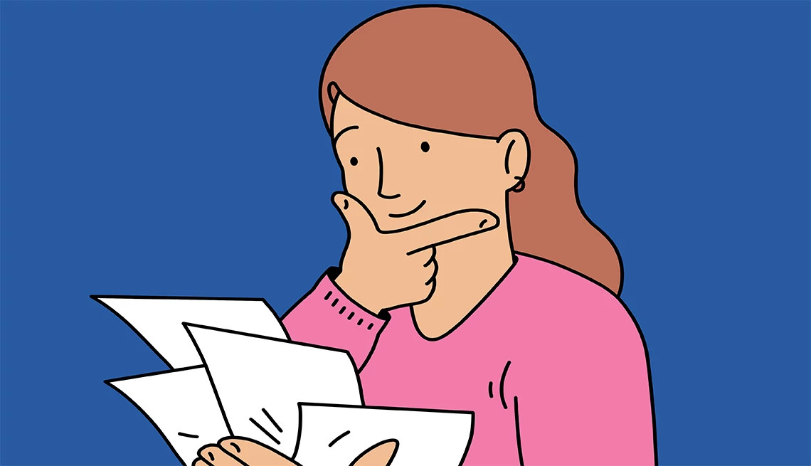 a woman looks thoughtfully at multiple pieces of paper