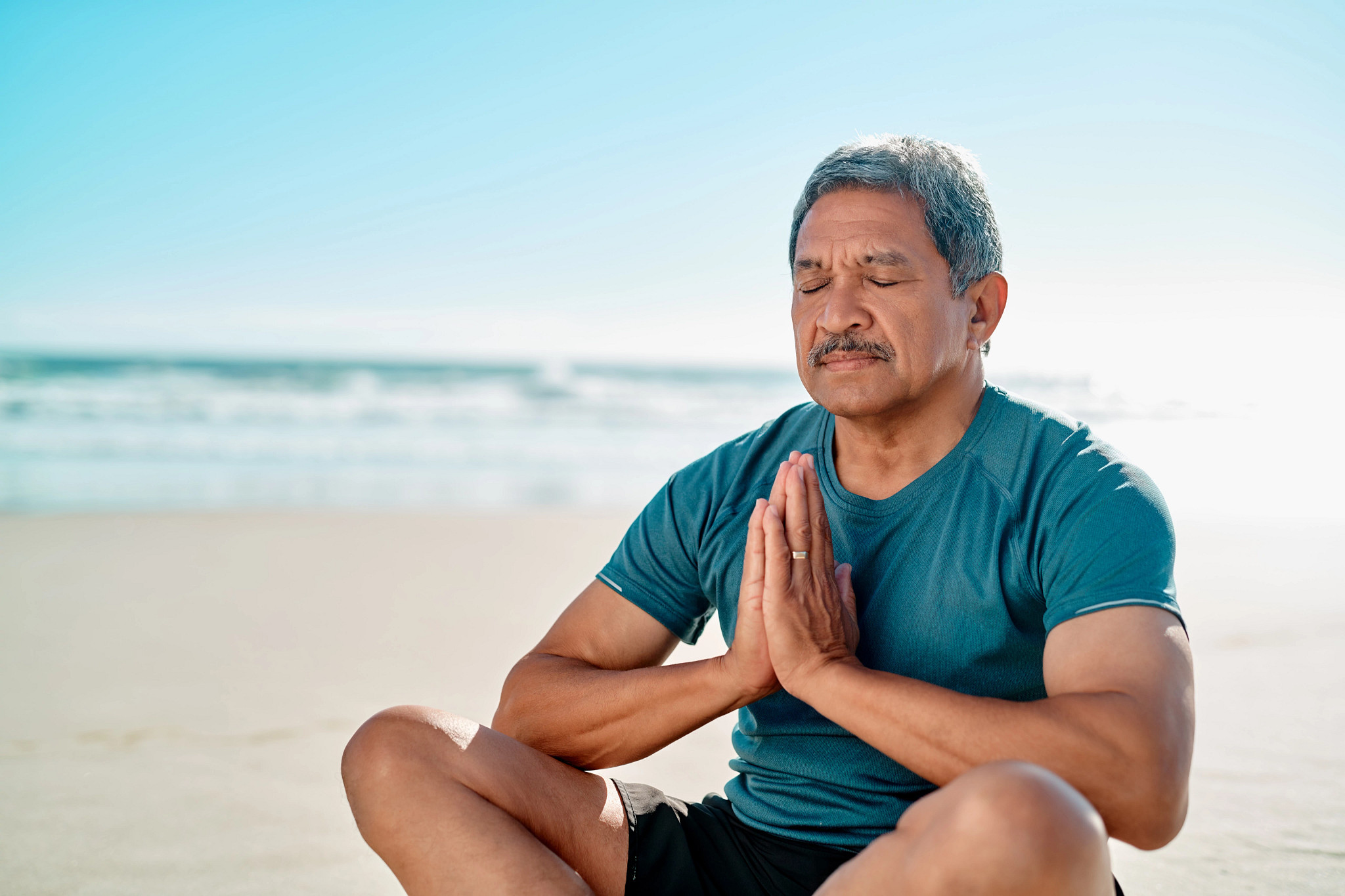 man and woman watching tai chi instruction on screen
