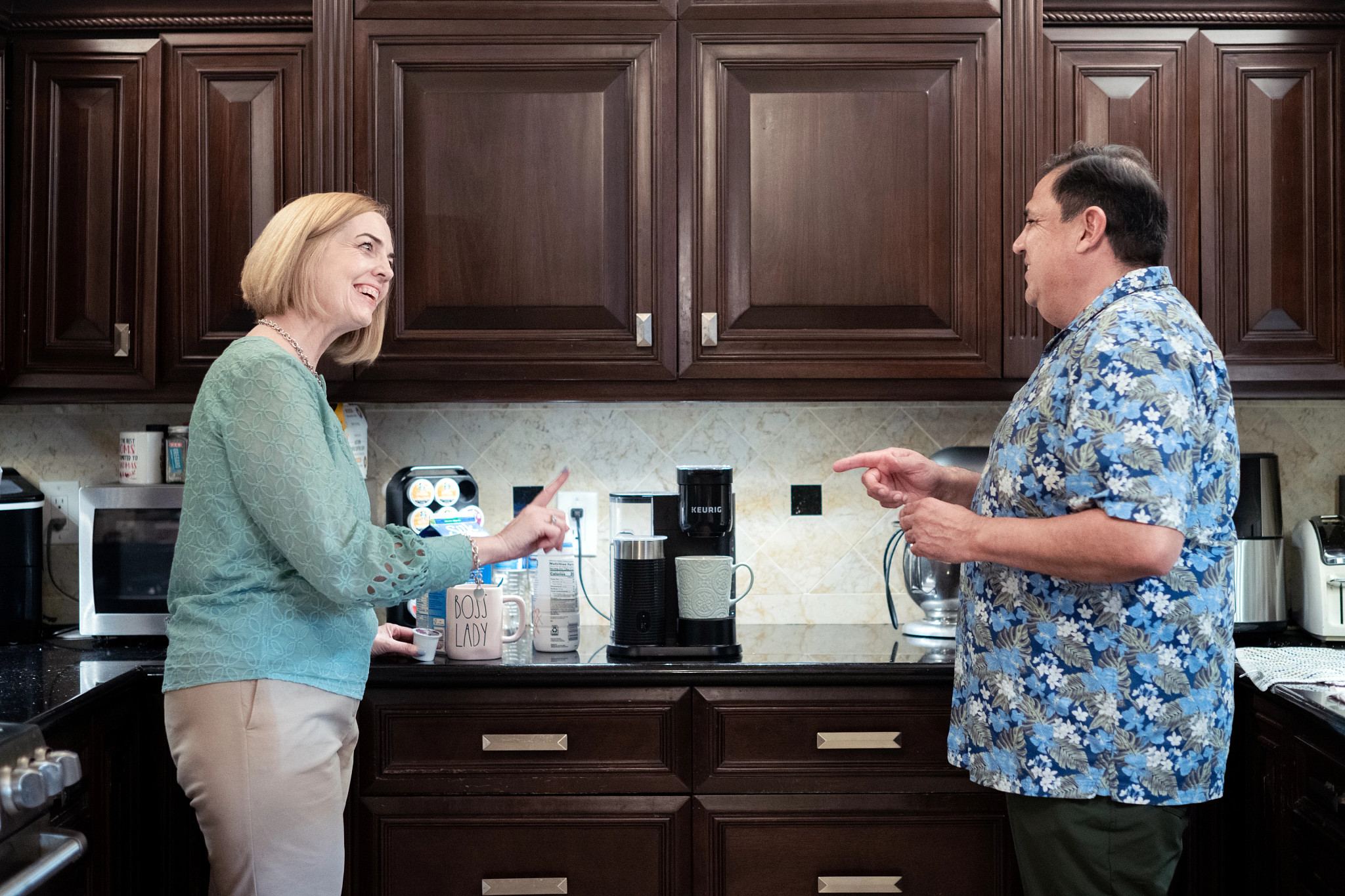 donna tovalin shares a cup of coffee and laughs with her husband, jaime tovalin, at their home