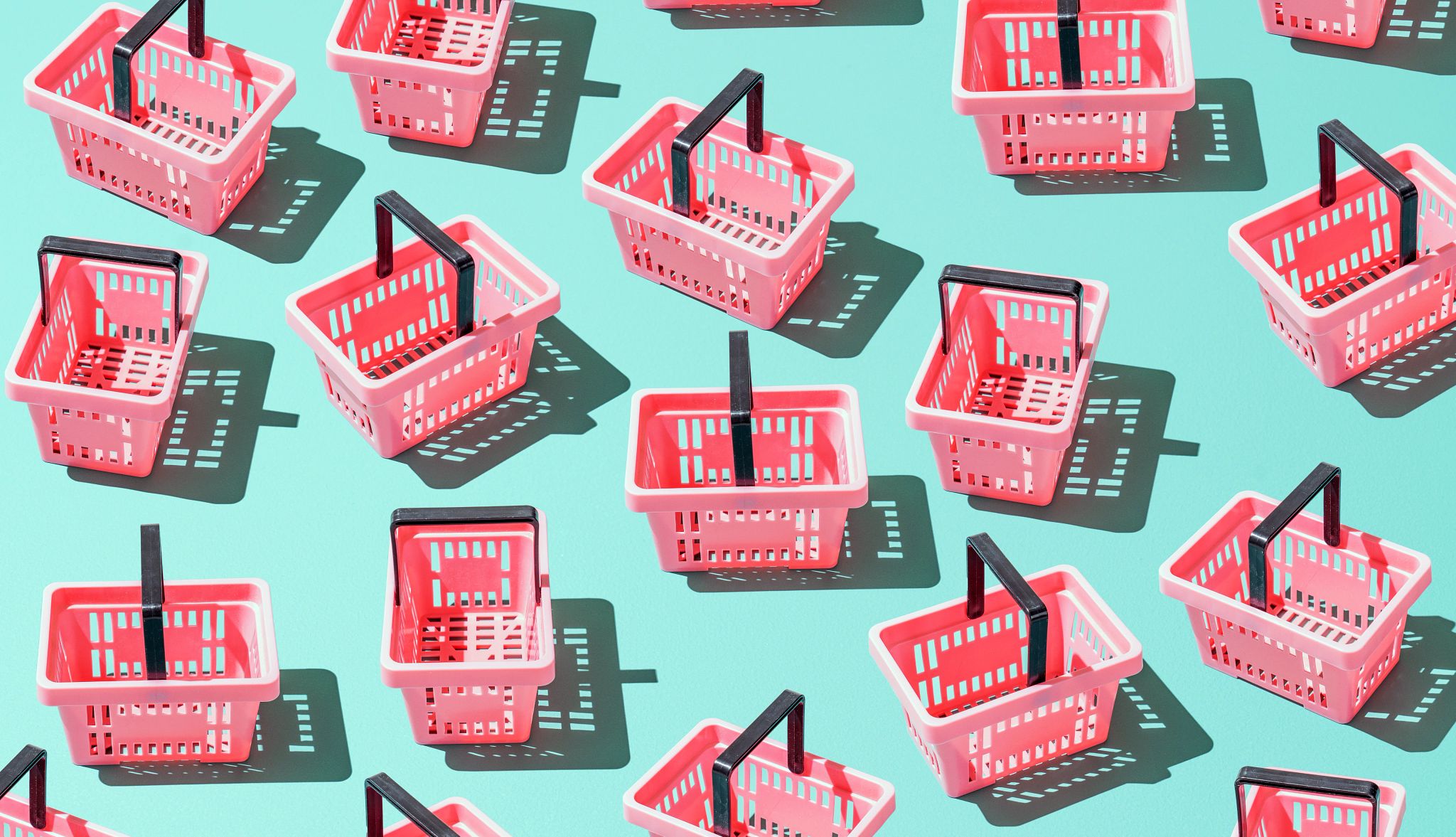 Adults Not Claiming SNAP Benefits a number of pink shopping baskets on a light teal background