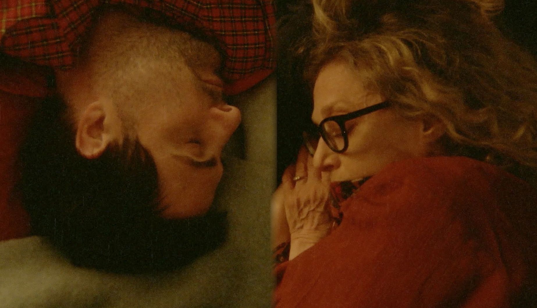 Between the Temples Jason Schwartzman and Carol Kane lying next to each other in the film Between the Temples