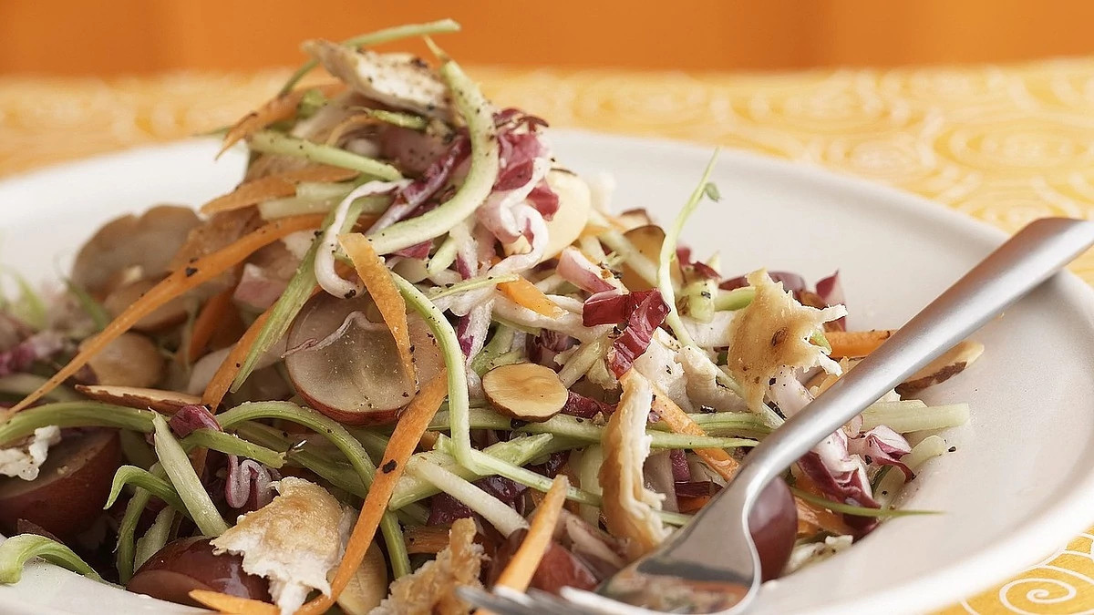 A close-up view of turkey-broccoli salad with grapes