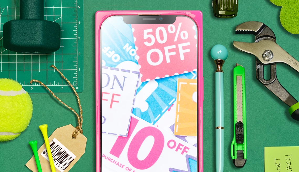digital coupons a smartphone with coupons on the screen surrounded by items