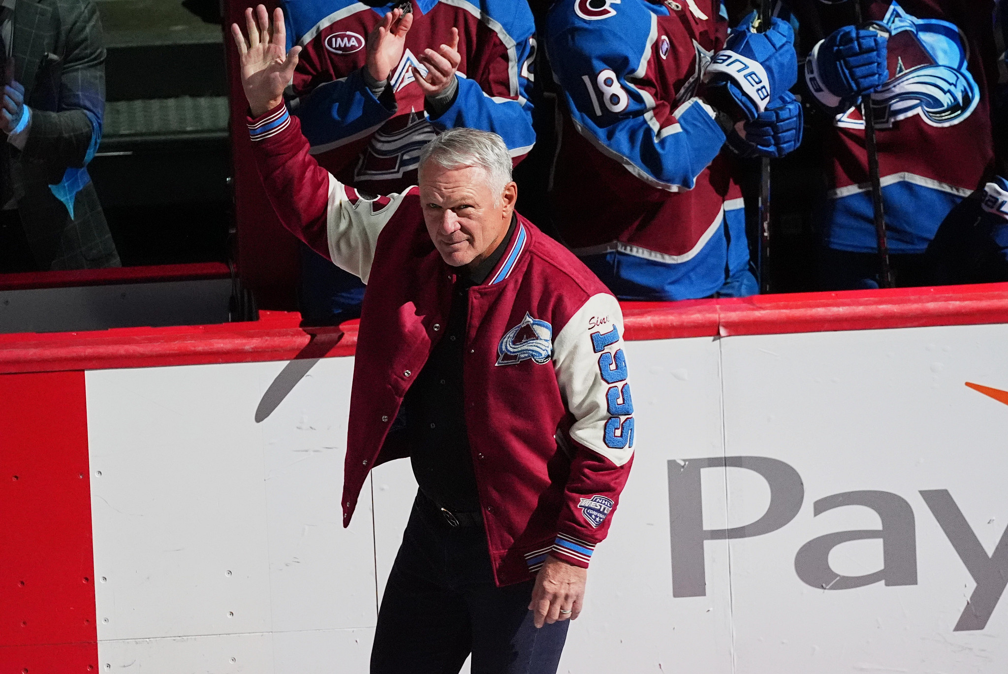 claude lemieux in a letterman style jacket greeting fans