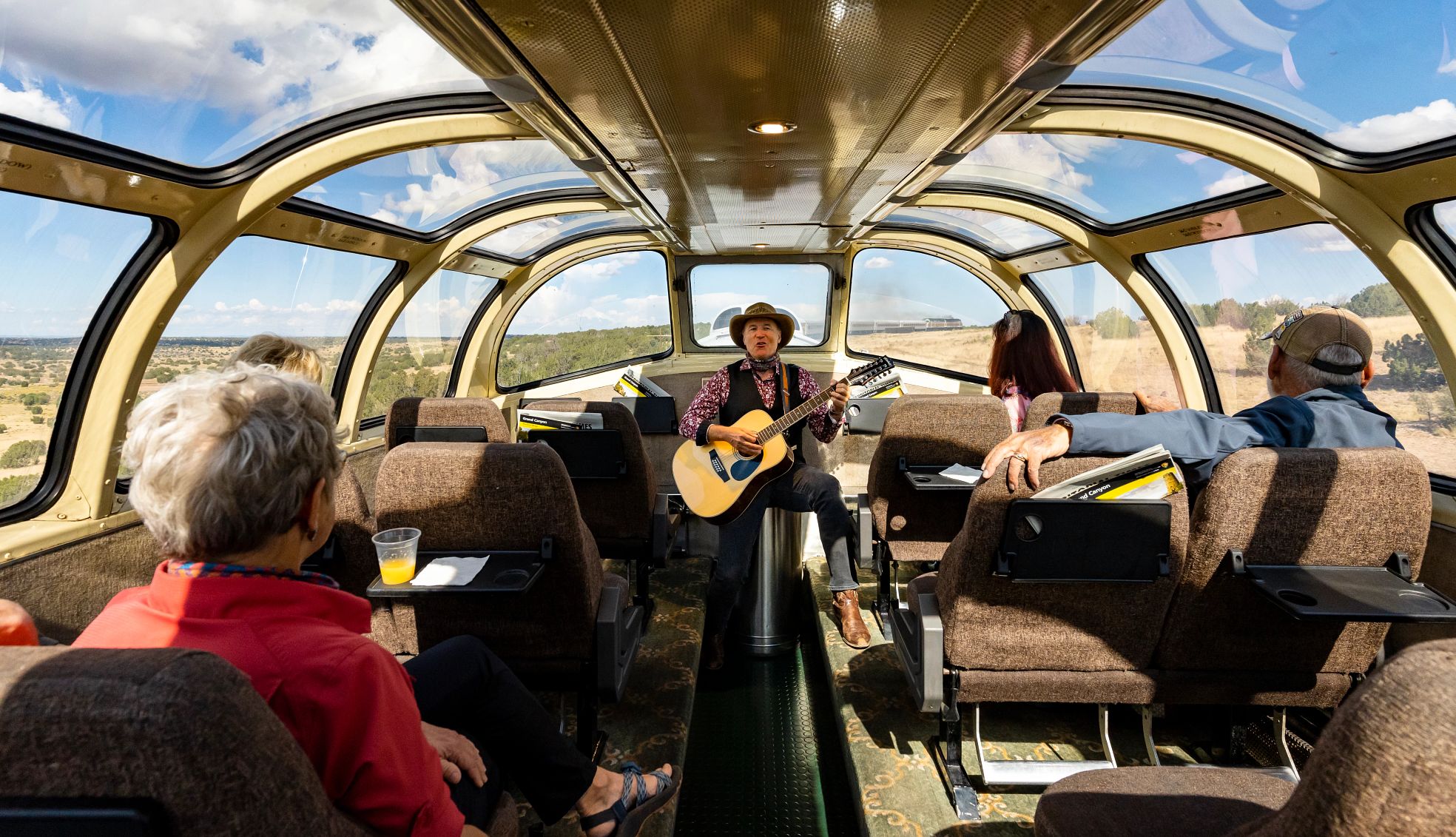 you can take the Grand Canyon Railway to the Grand Canyon cowbgirls and musicians entertain travelers on the Grand Canyon Railway