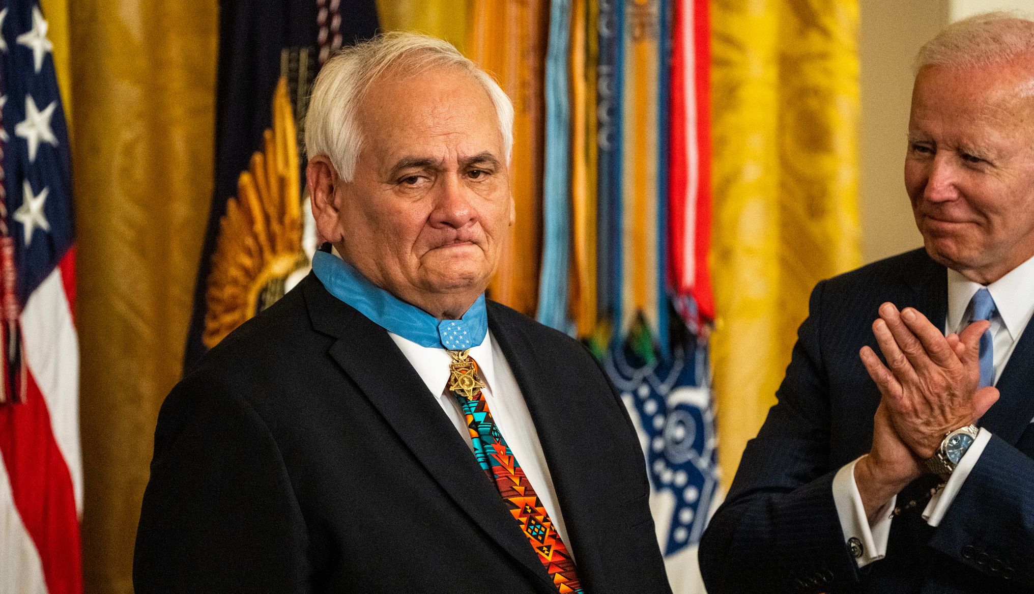 Joe Biden and Dwight W. Birdwell joe biden claps while looking at dwight w birdwell, who just received the medal of honor