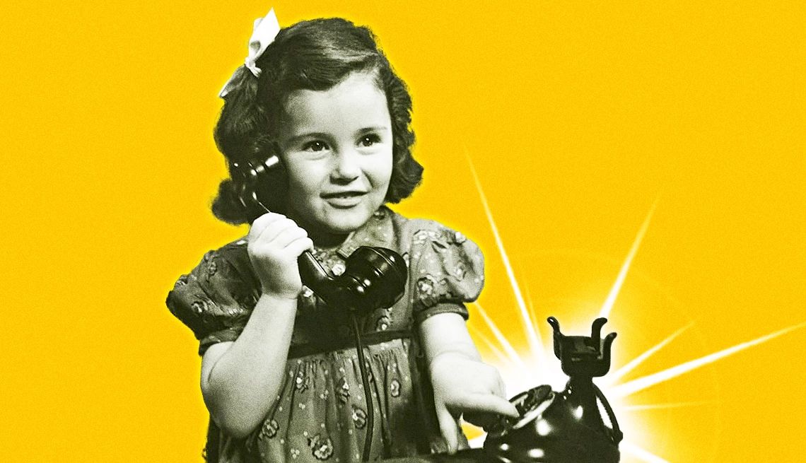 Useless Skills From Your Boomer and Gen X Childhood a little girl making a call on an old phone