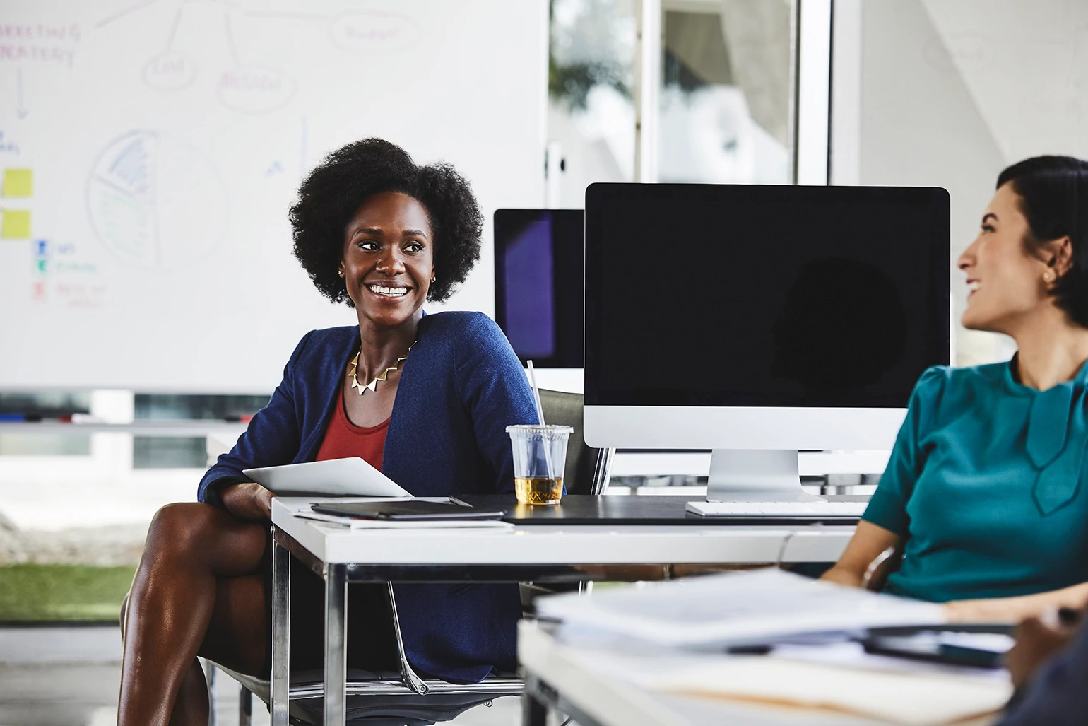 Two women at their job working happily together.
