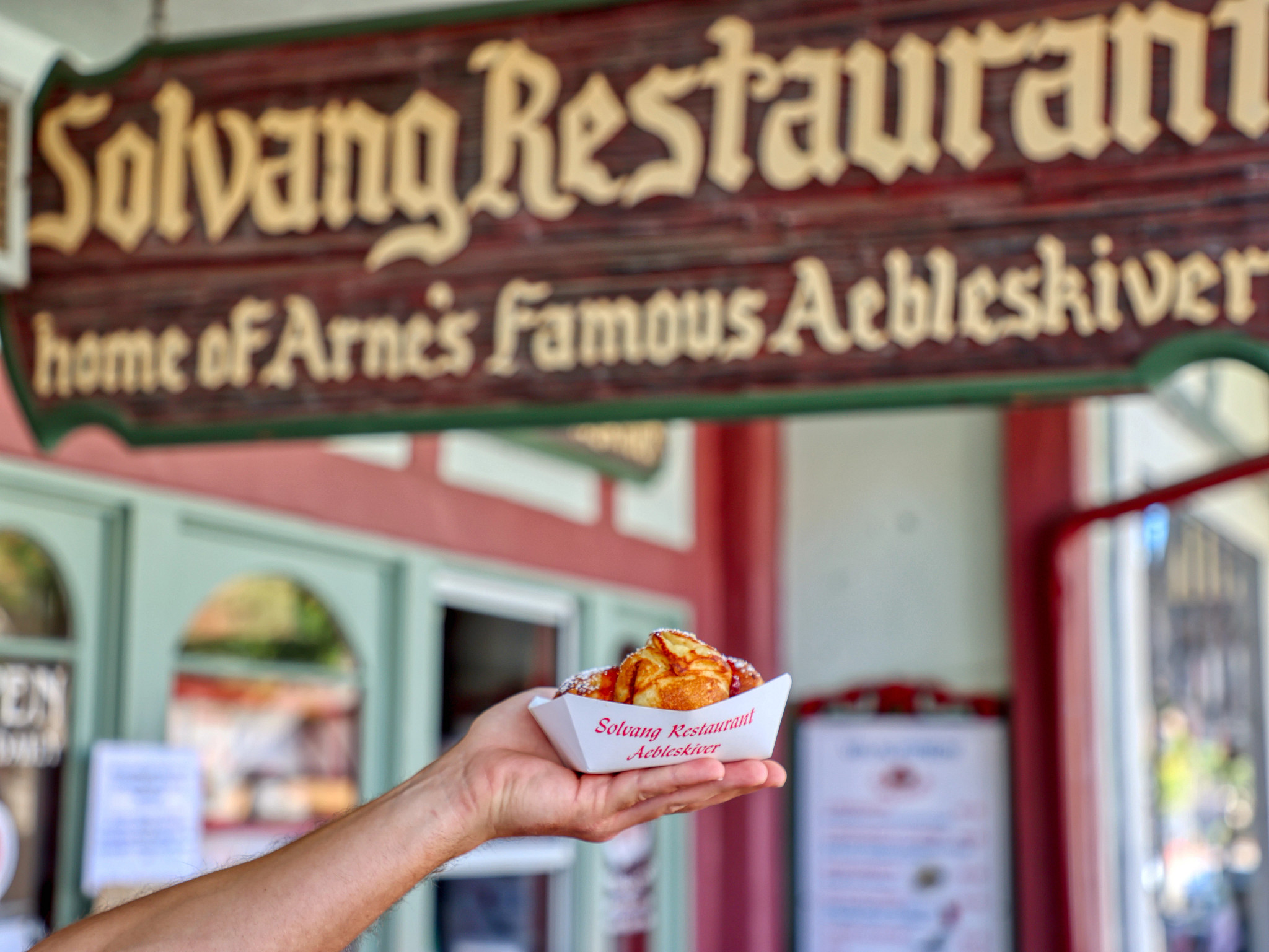 a person holding pastries