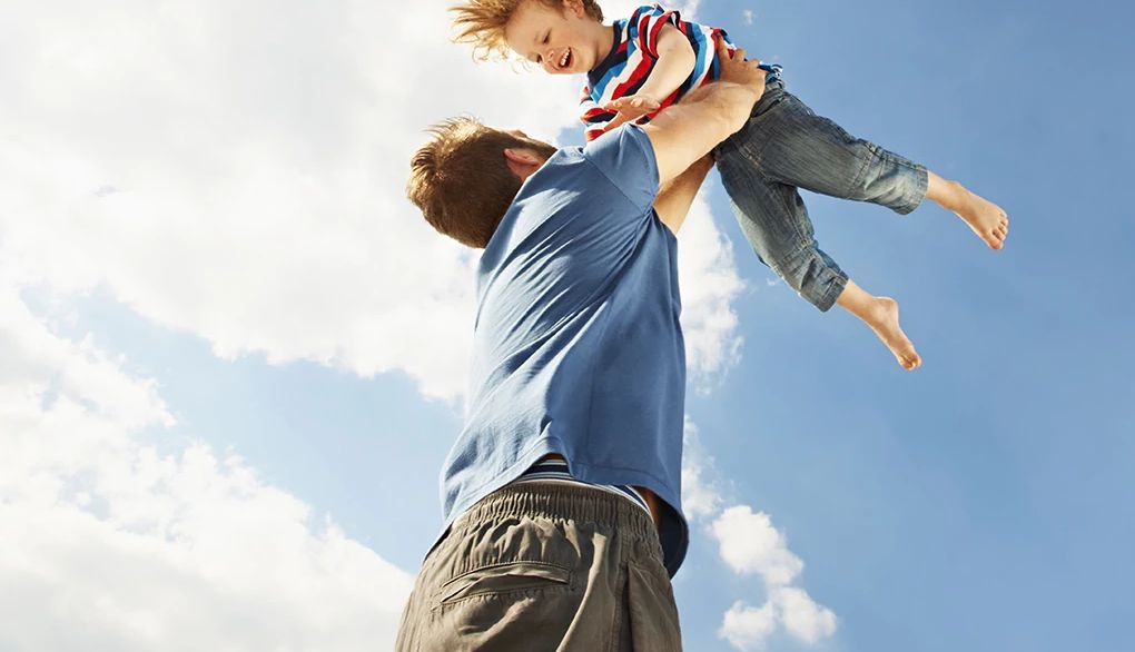 Children are a responsibility that may cause you to worry A man lifting a boy up in the air