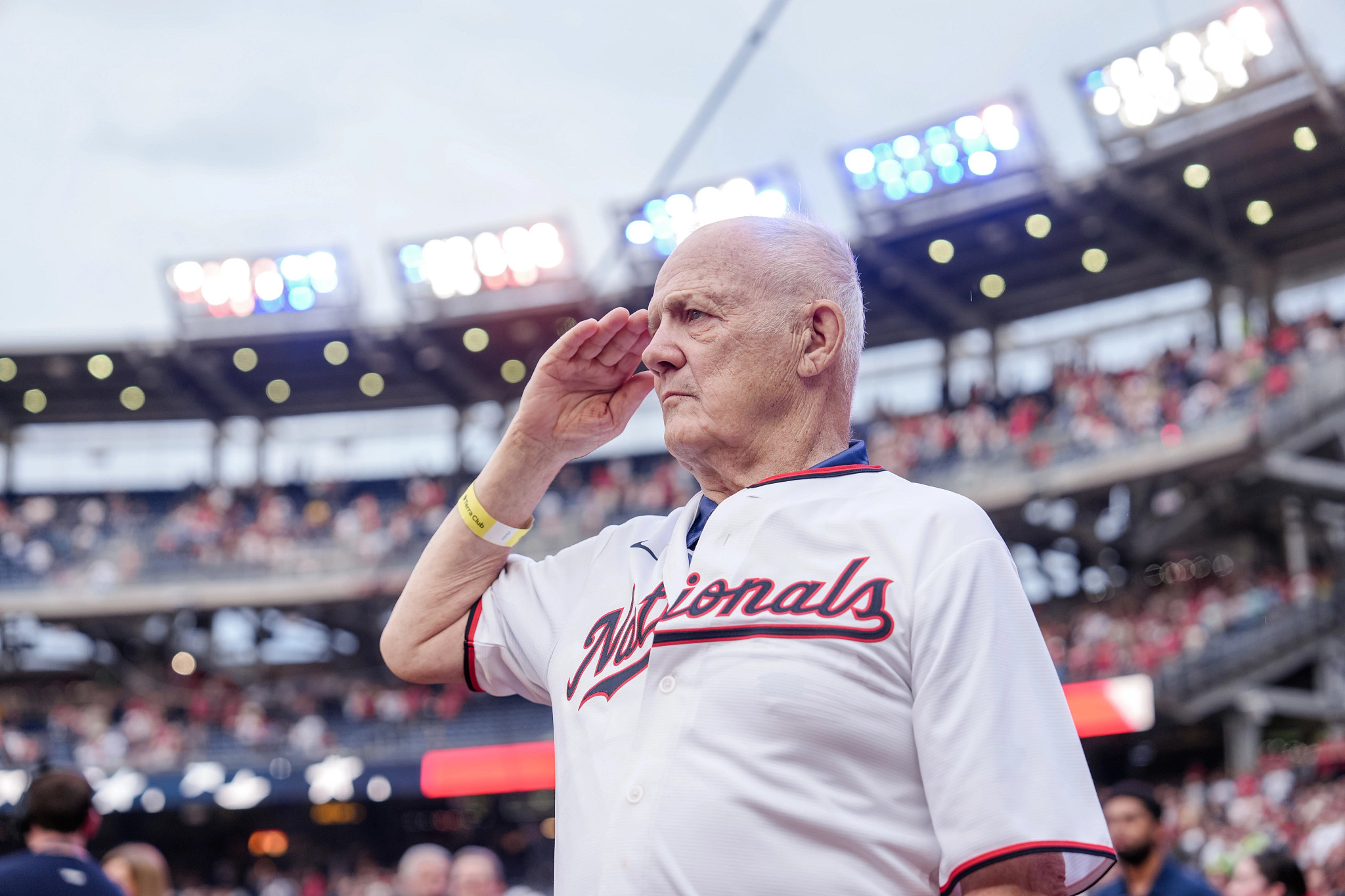 Ken Kroiss salutes during the National Anthem at a Washington Nationals baseball game.