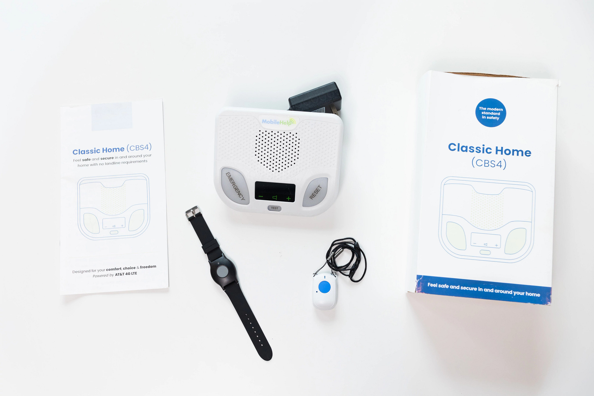 The MobileHelp Classic Home device components on a white table