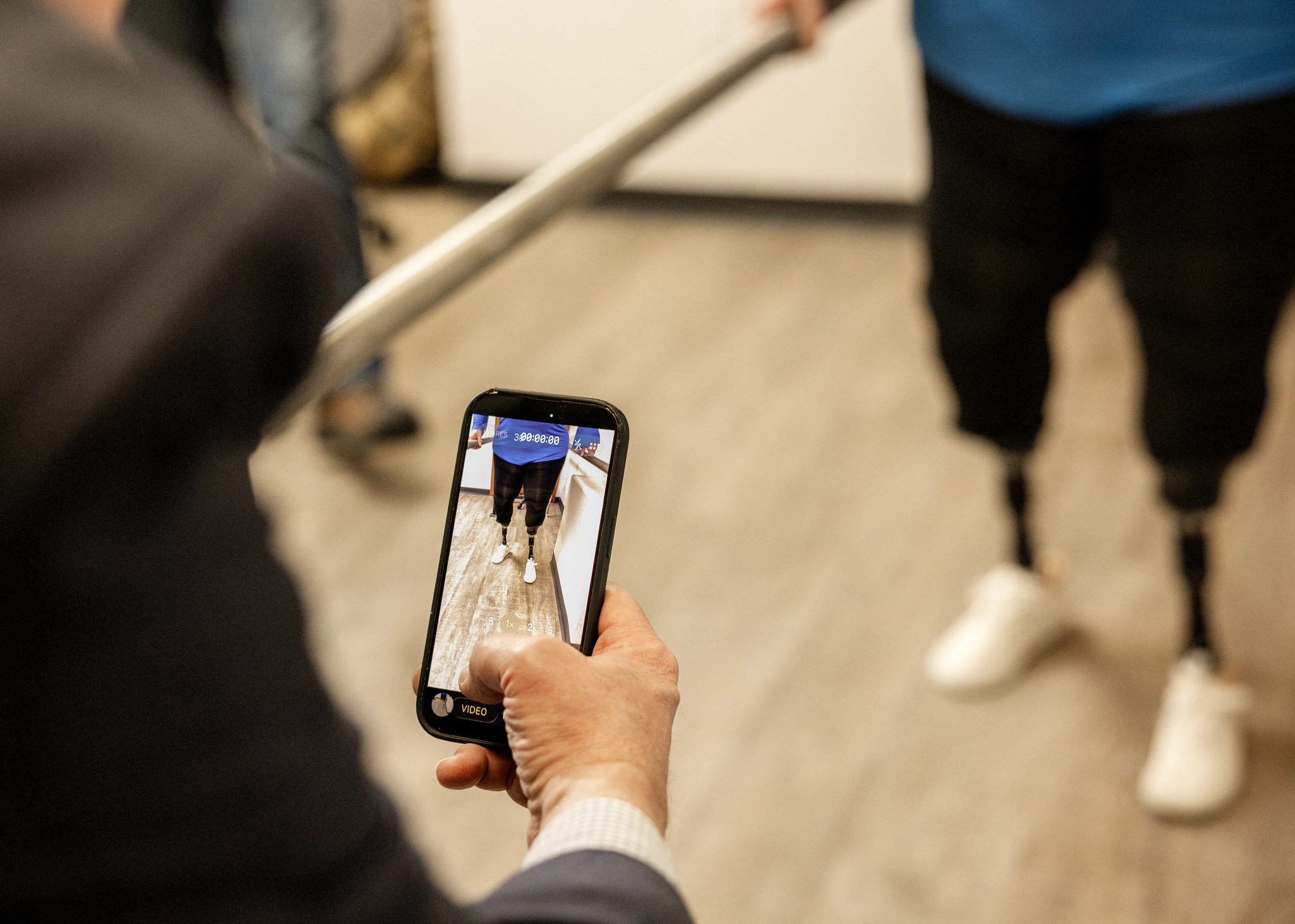 a person going through rehab with people behind them