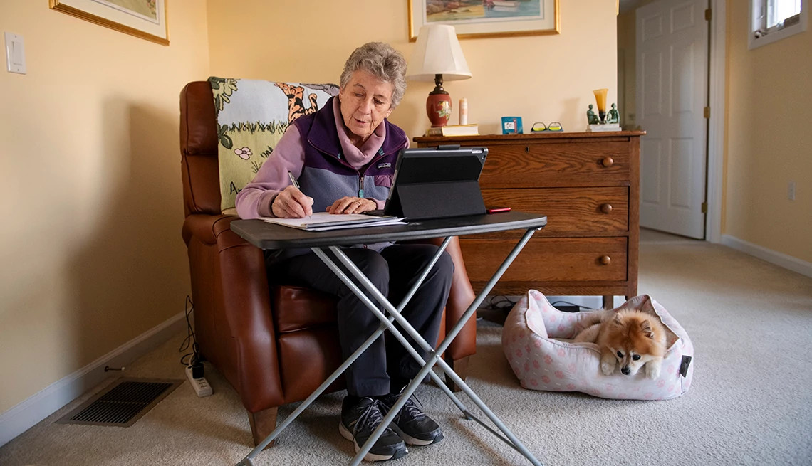 Senior Caucasian woman sits in her home