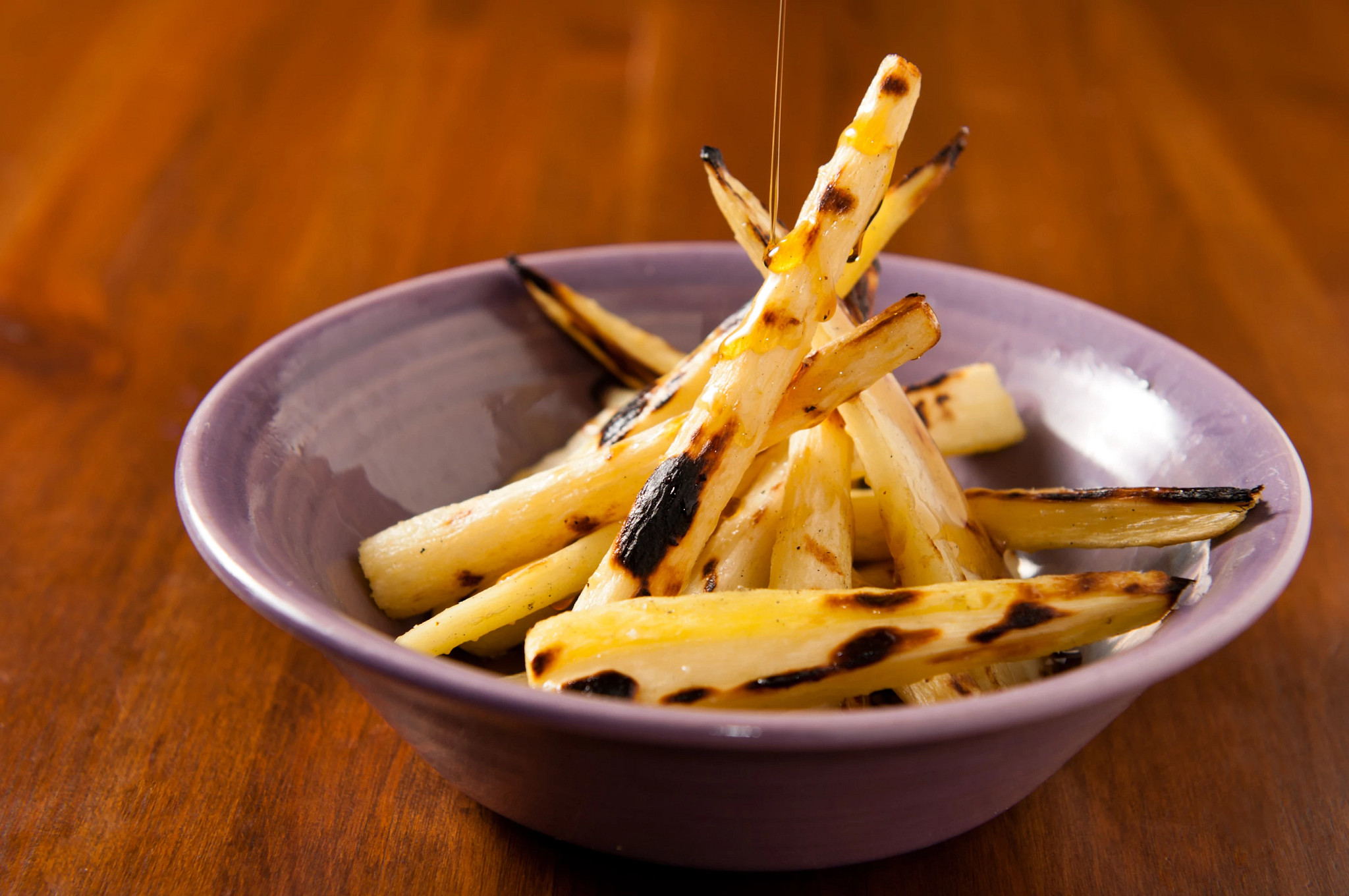 a photo shows parsnip veggie fries in an medium sized ramakin 