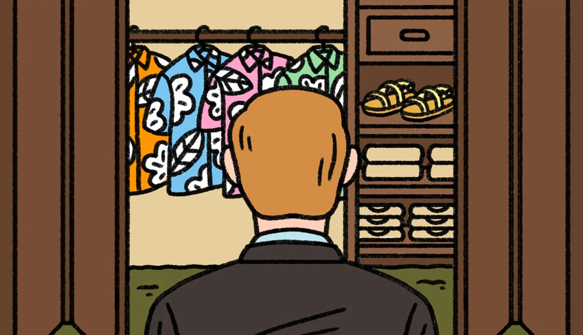 a man looks into a closet filled with colorful hawaiian shirts